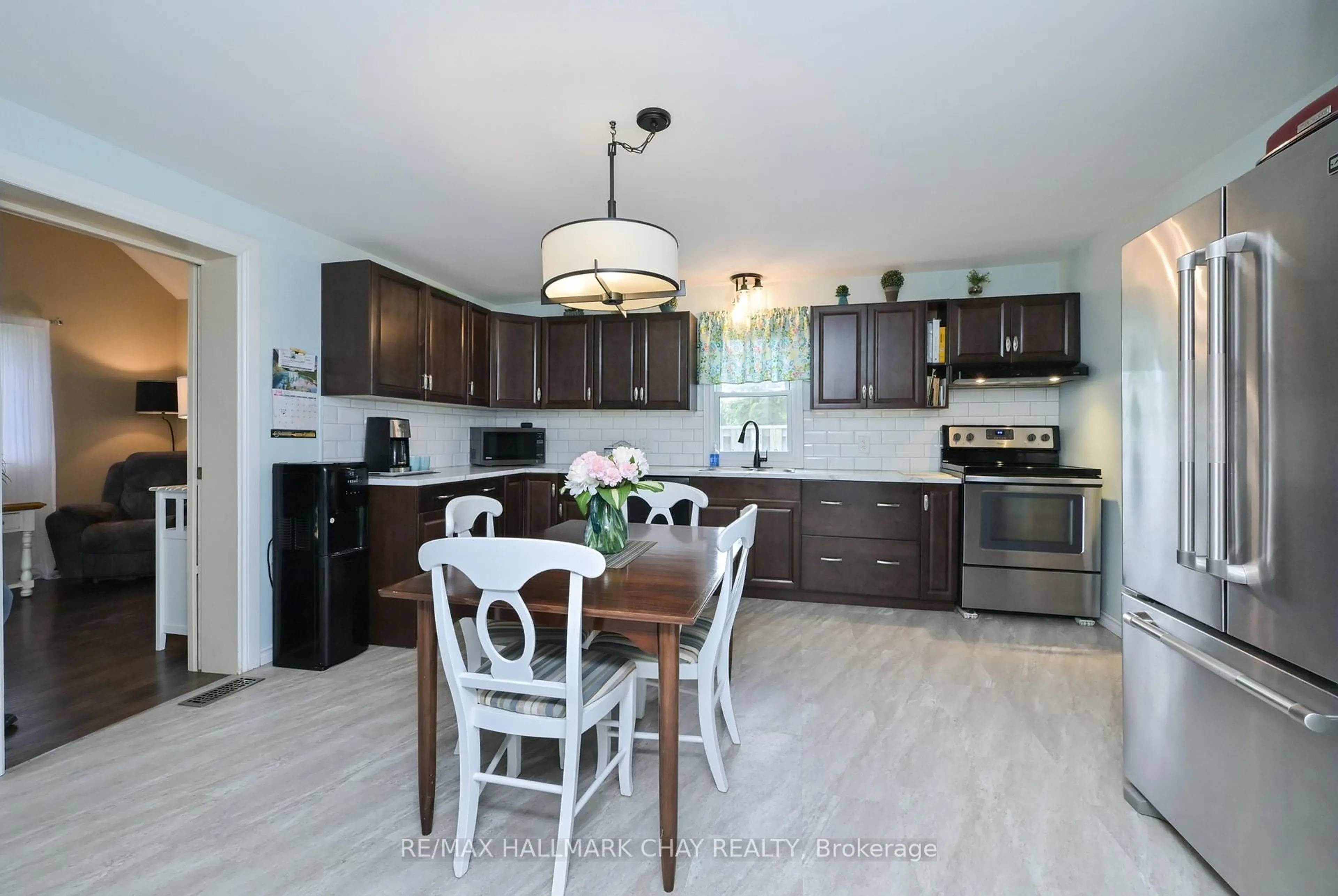 Open concept kitchen, wood/laminate floor for 141 Murphy Rd, Essa Ontario L0M 1B1