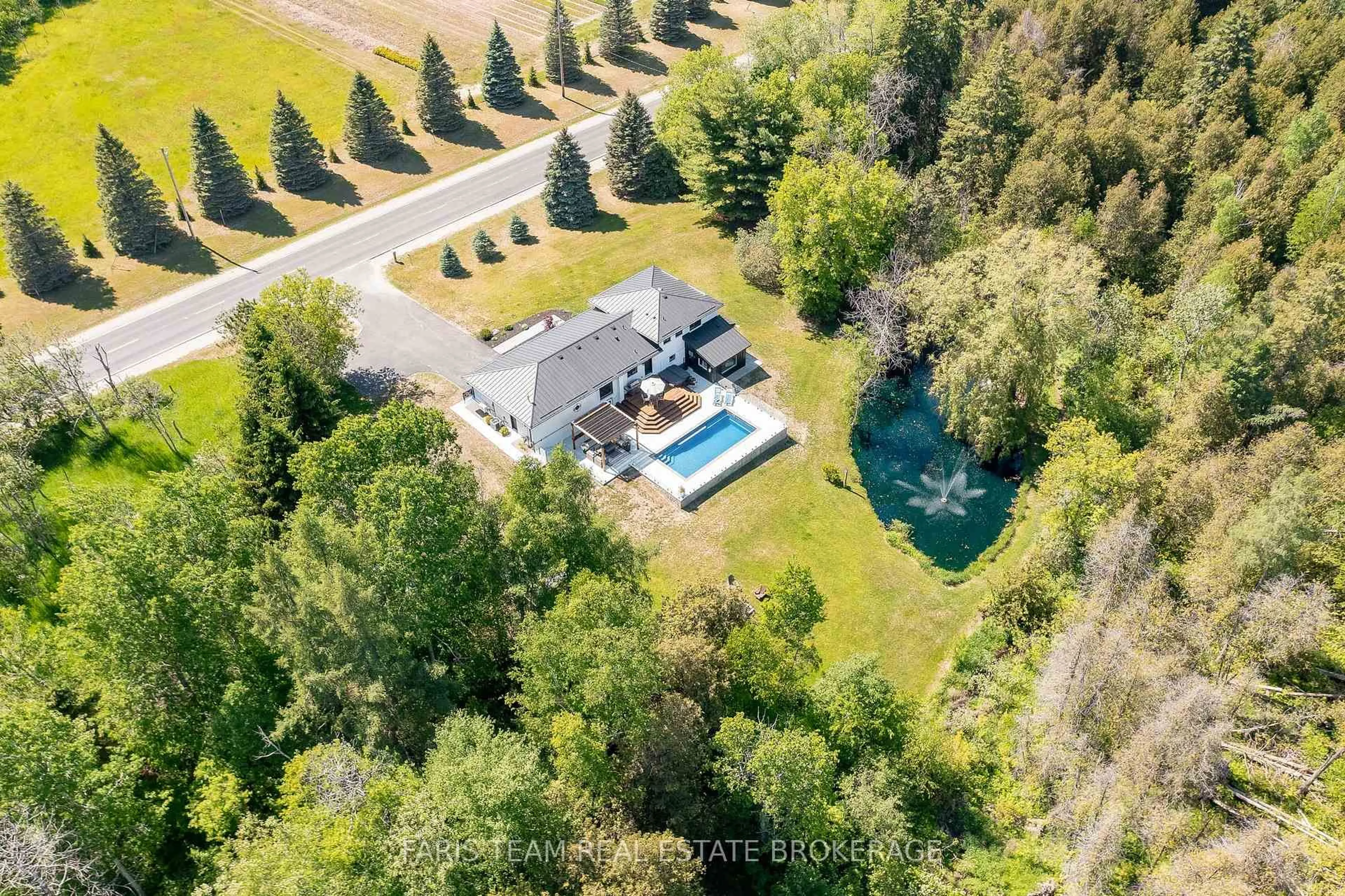 A pic from outside/outdoor area/front of a property/back of a property/a pic from drone, water/lake/river/ocean view for 5877 County Road 13, Adjala-Tosorontio Ontario L0M 1J0