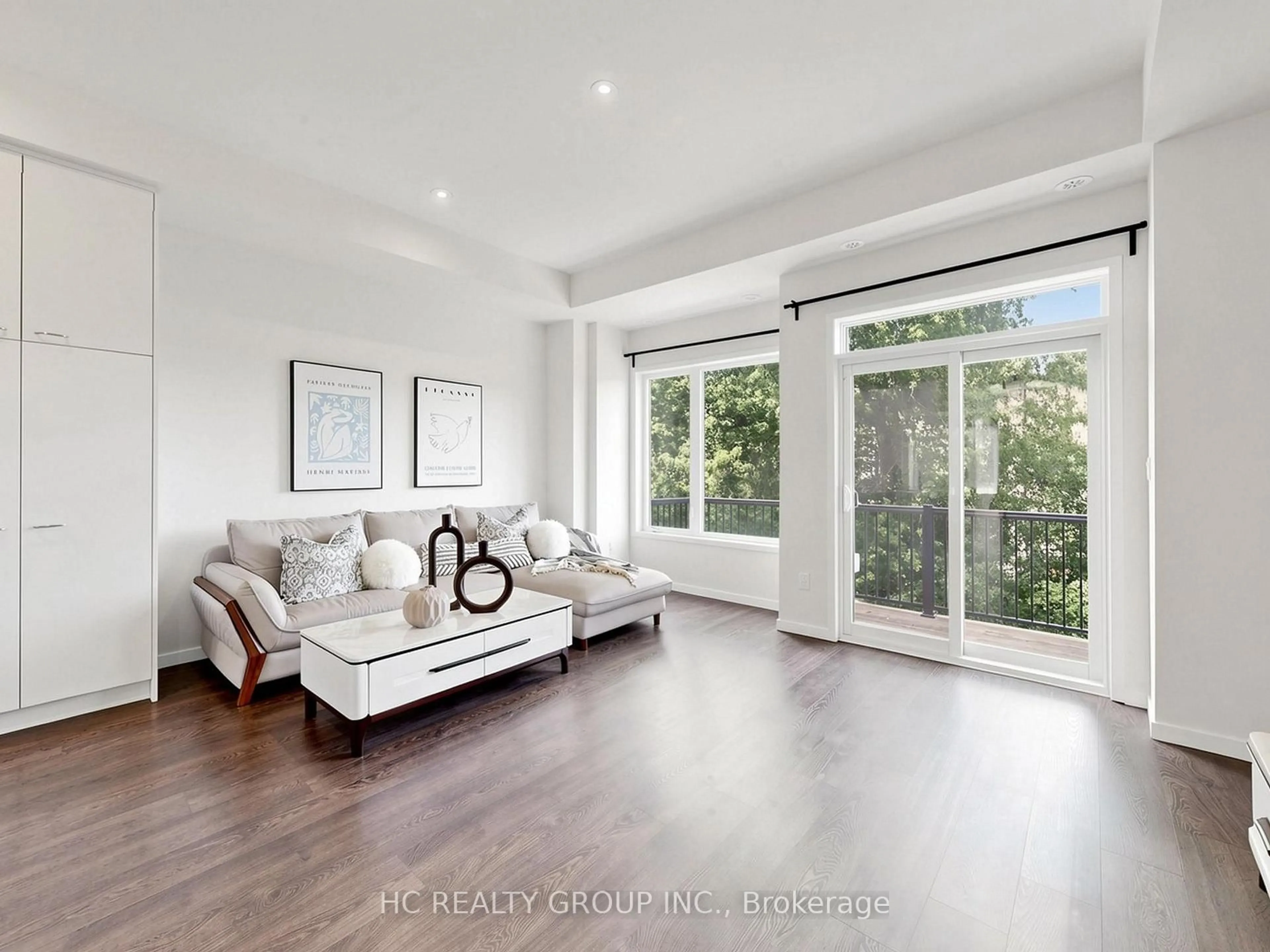 Living room with furniture, wood/laminate floor for 38 Lafferty Lane, Richmond Hill Ontario L4C 0Z8