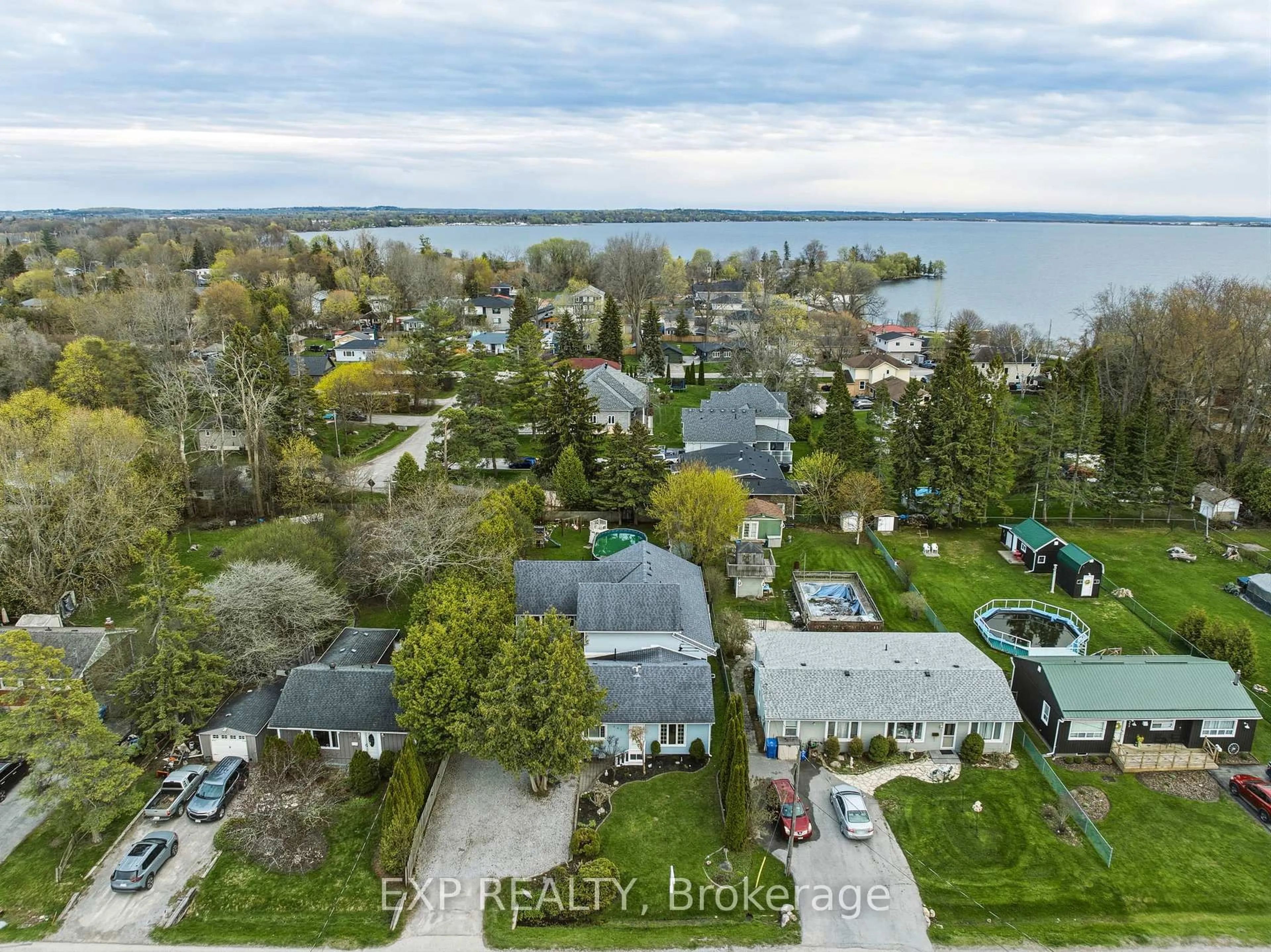 A pic from outside/outdoor area/front of a property/back of a property/a pic from drone, water/lake/river/ocean view for 287 Elmview Gdns, Georgina Ontario L4P 1E9