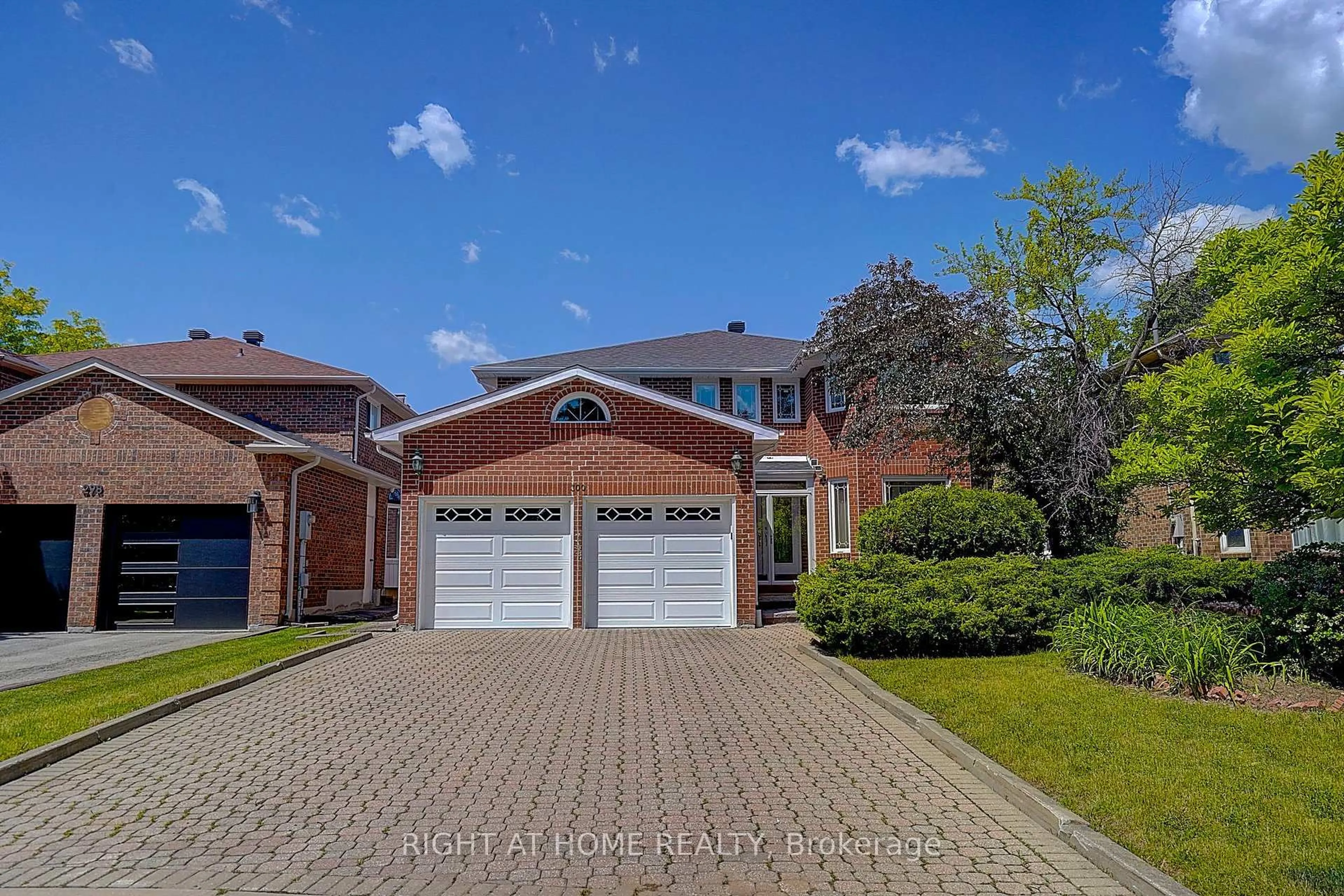 Home with brick exterior material, street for 300 Green Lane, Markham Ontario L3T 7A6