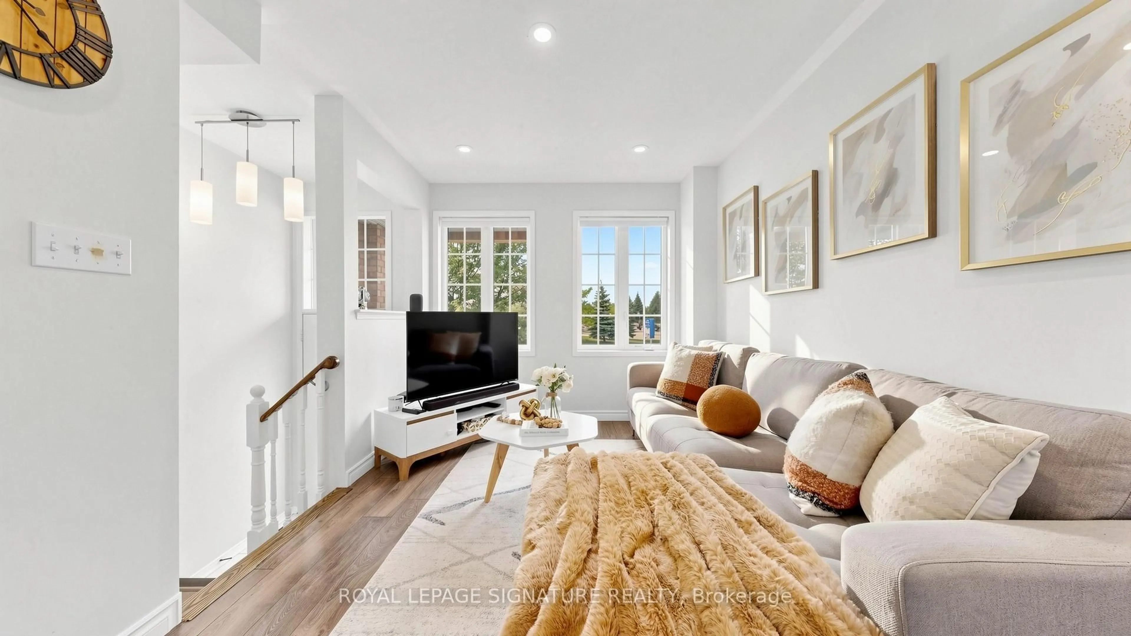 Living room with furniture, wood/laminate floor for 383 White's Hill Ave, Markham Ontario L6B 0J4
