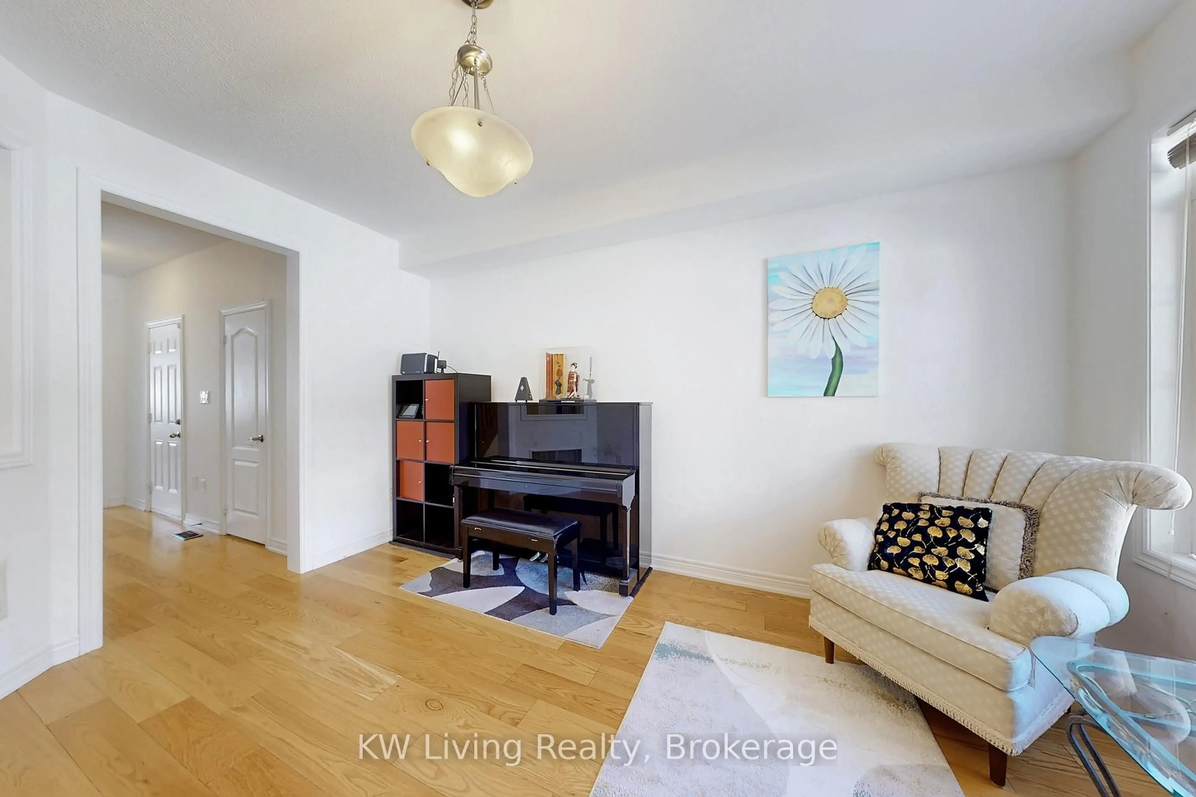 Living room with furniture, wood/laminate floor for 19 Begonia St, Markham Ontario L6E 0N3