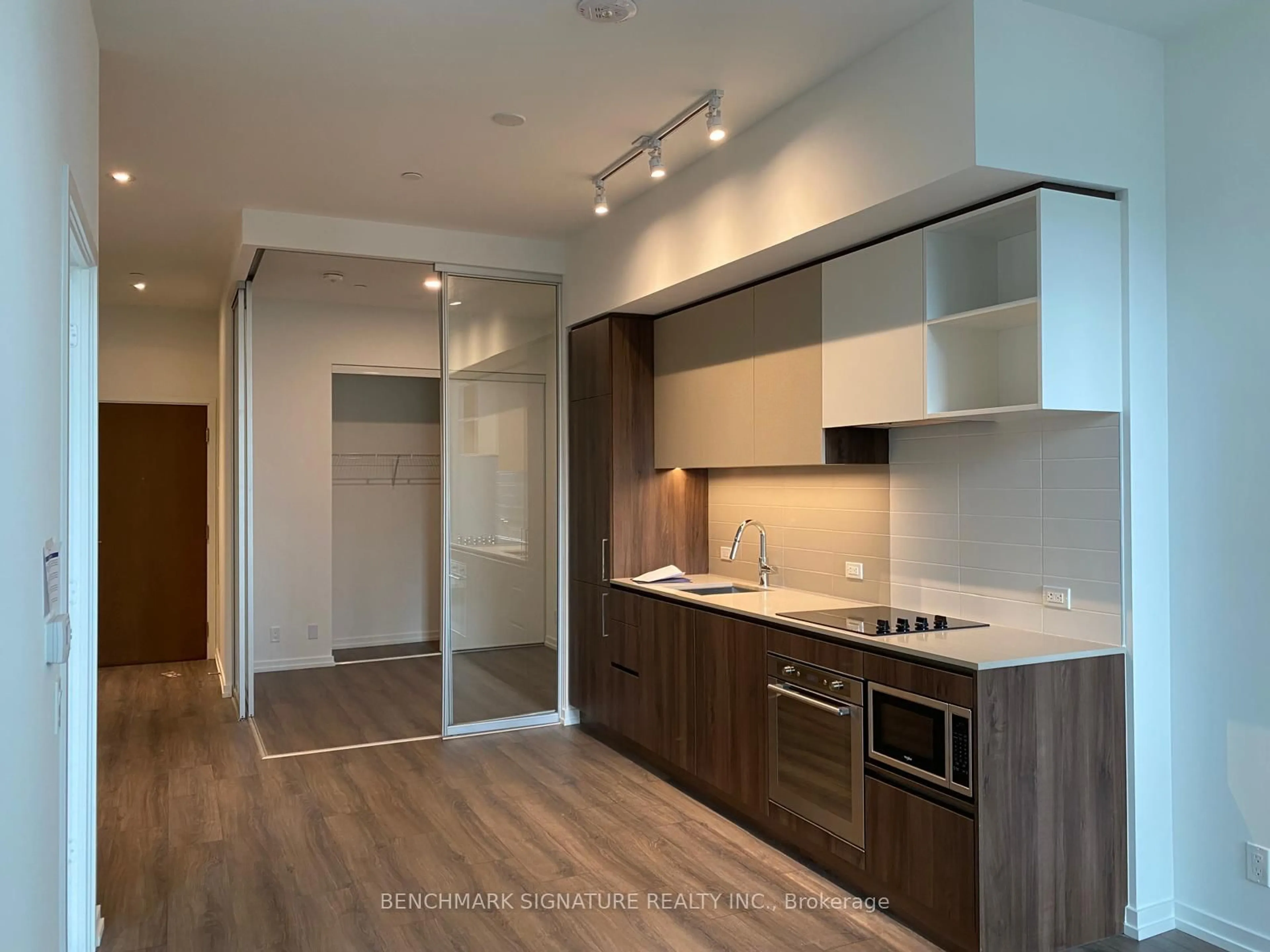 Open concept kitchen, wood/laminate floor for 7890 Jane St #302, Vaughan Ontario L4K 0K9