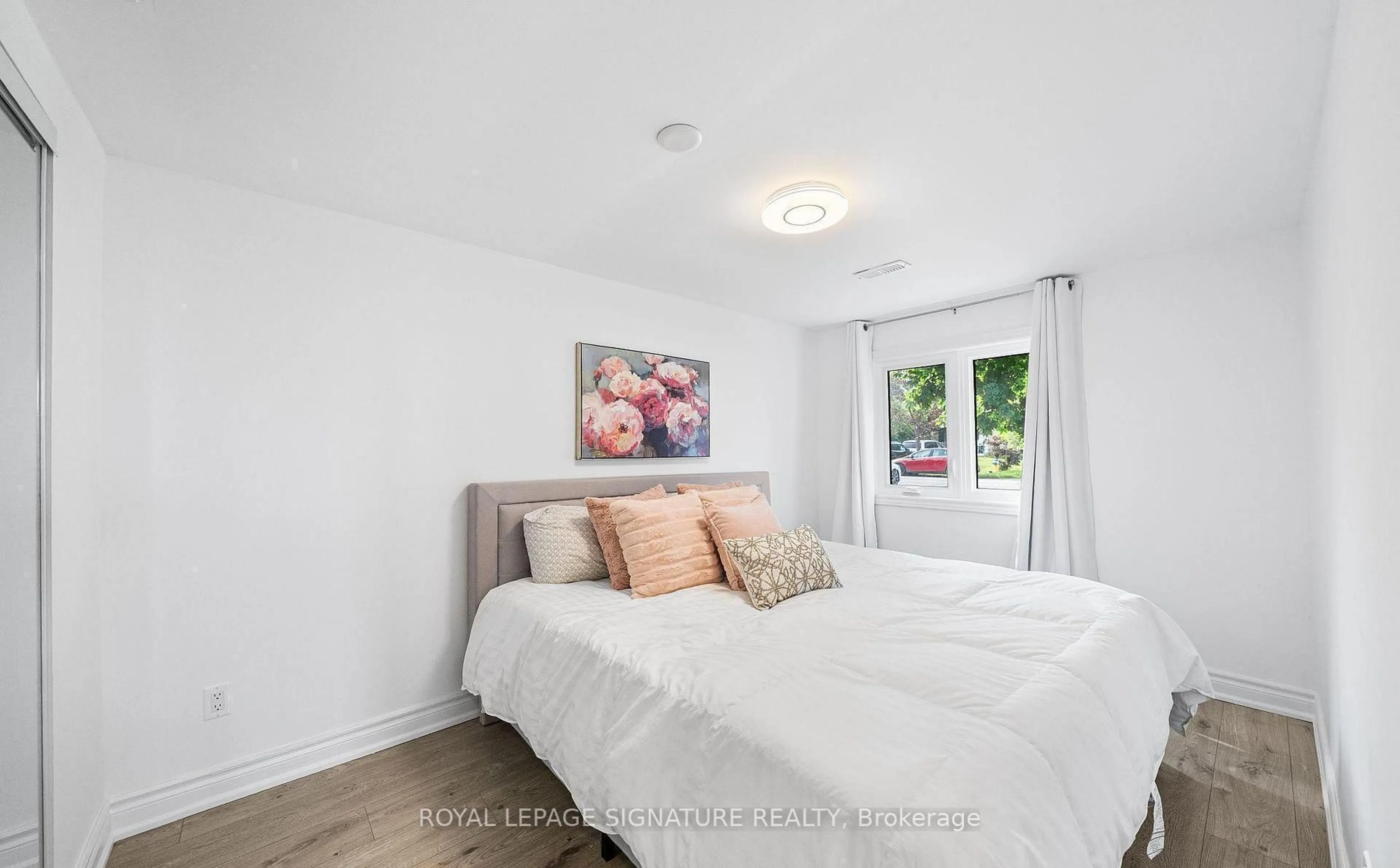 Bedroom with bed, wood/laminate floor for 335 Miami Dr, Georgina Ontario L4P 2Z6
