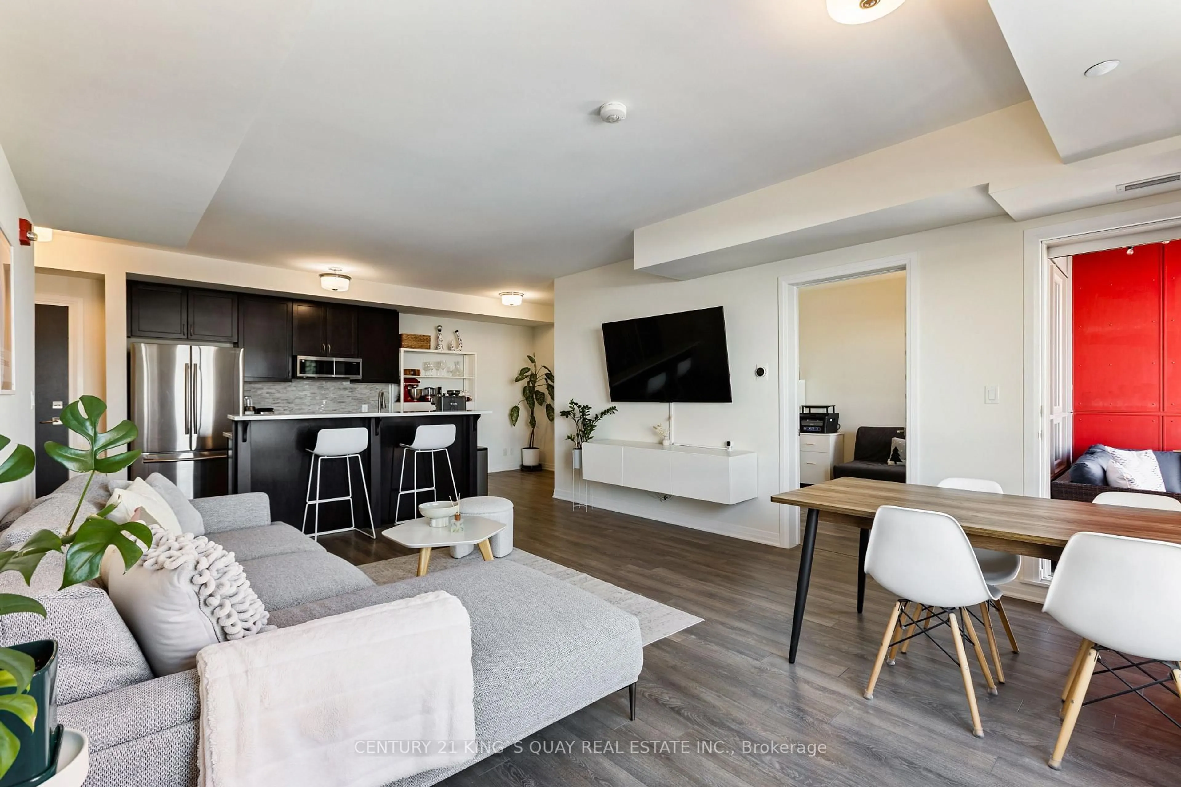 Living room with furniture, wood/laminate floor for 58 Adam Sellers St #503, Markham Ontario L6B 1P5