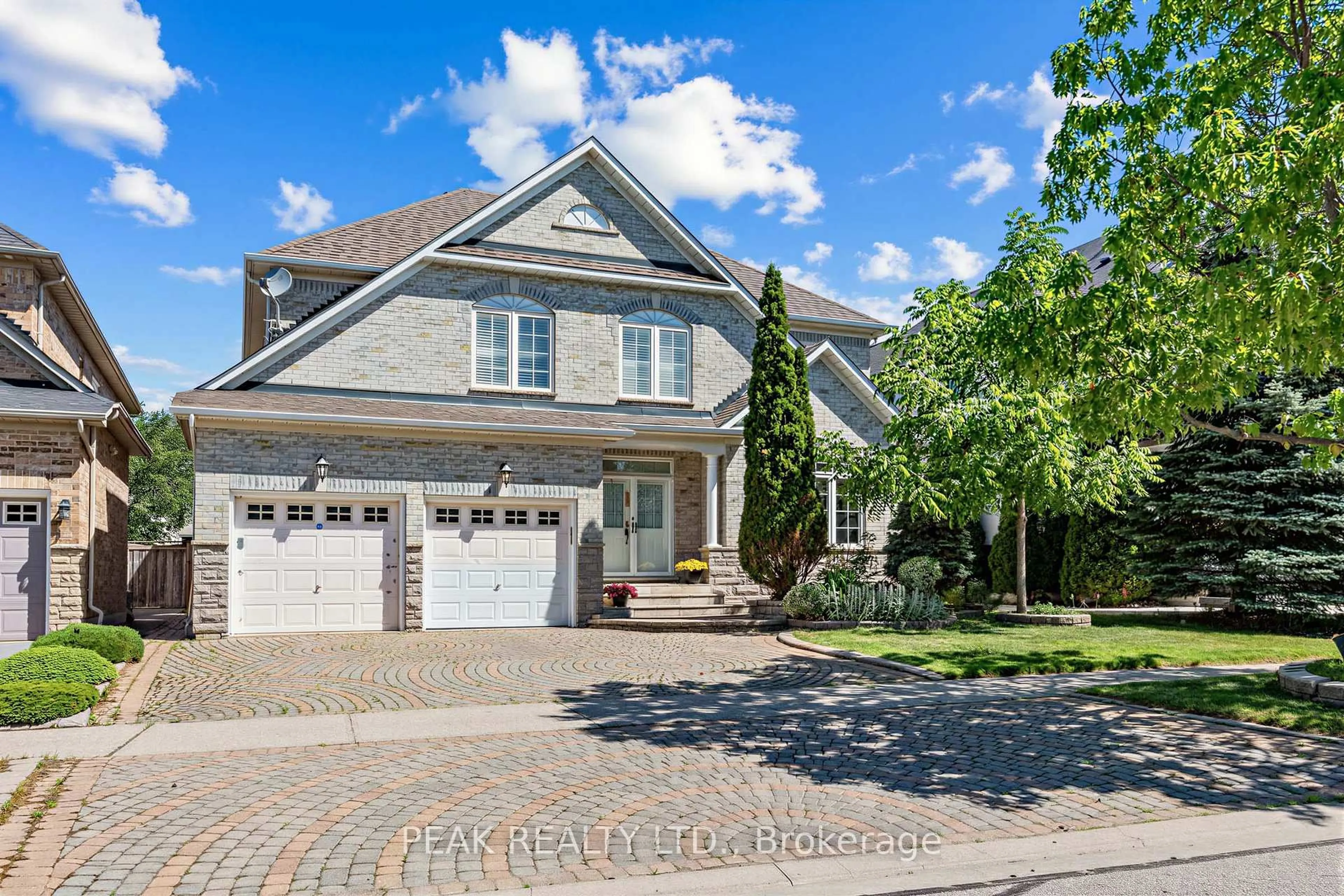 Home with brick exterior material, street for 66 Hollylane Dr, Markham Ontario L6C 2J9