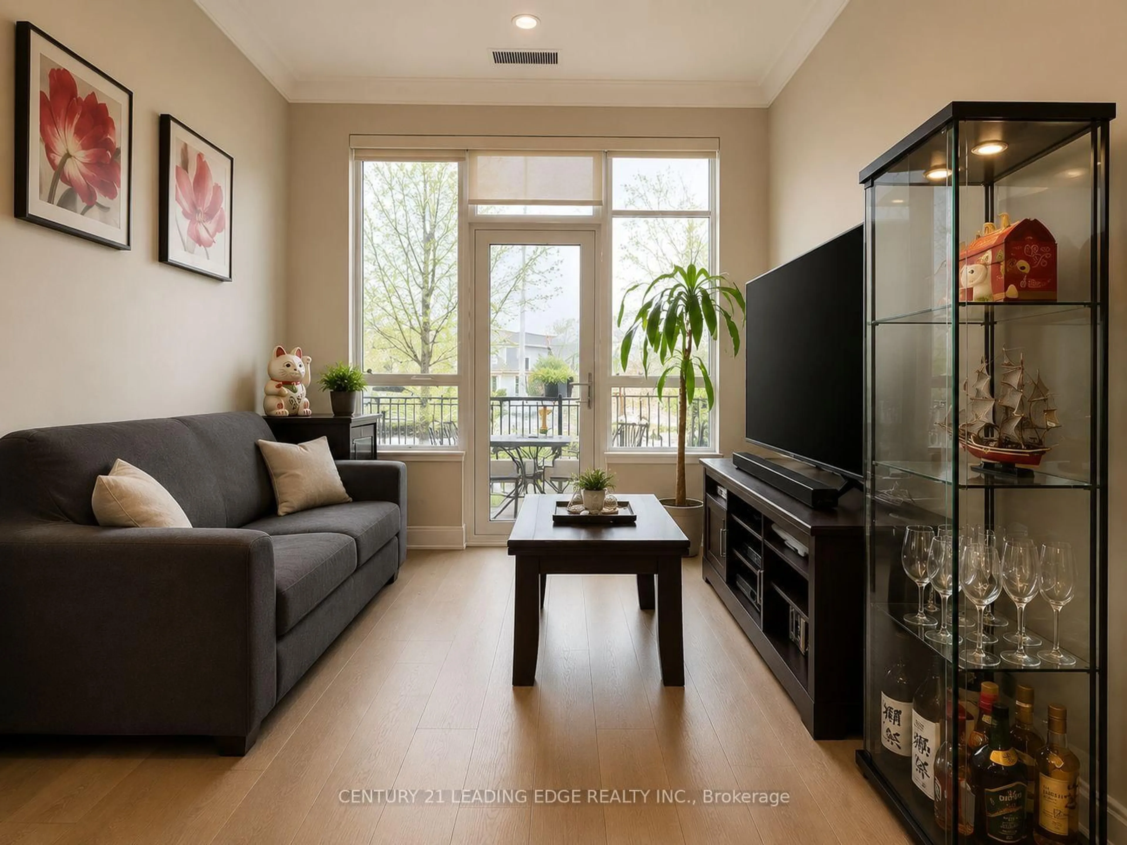 Living room with furniture, wood/laminate floor for 25 Water Walk Dr #121, Markham Ontario L6G 0G3