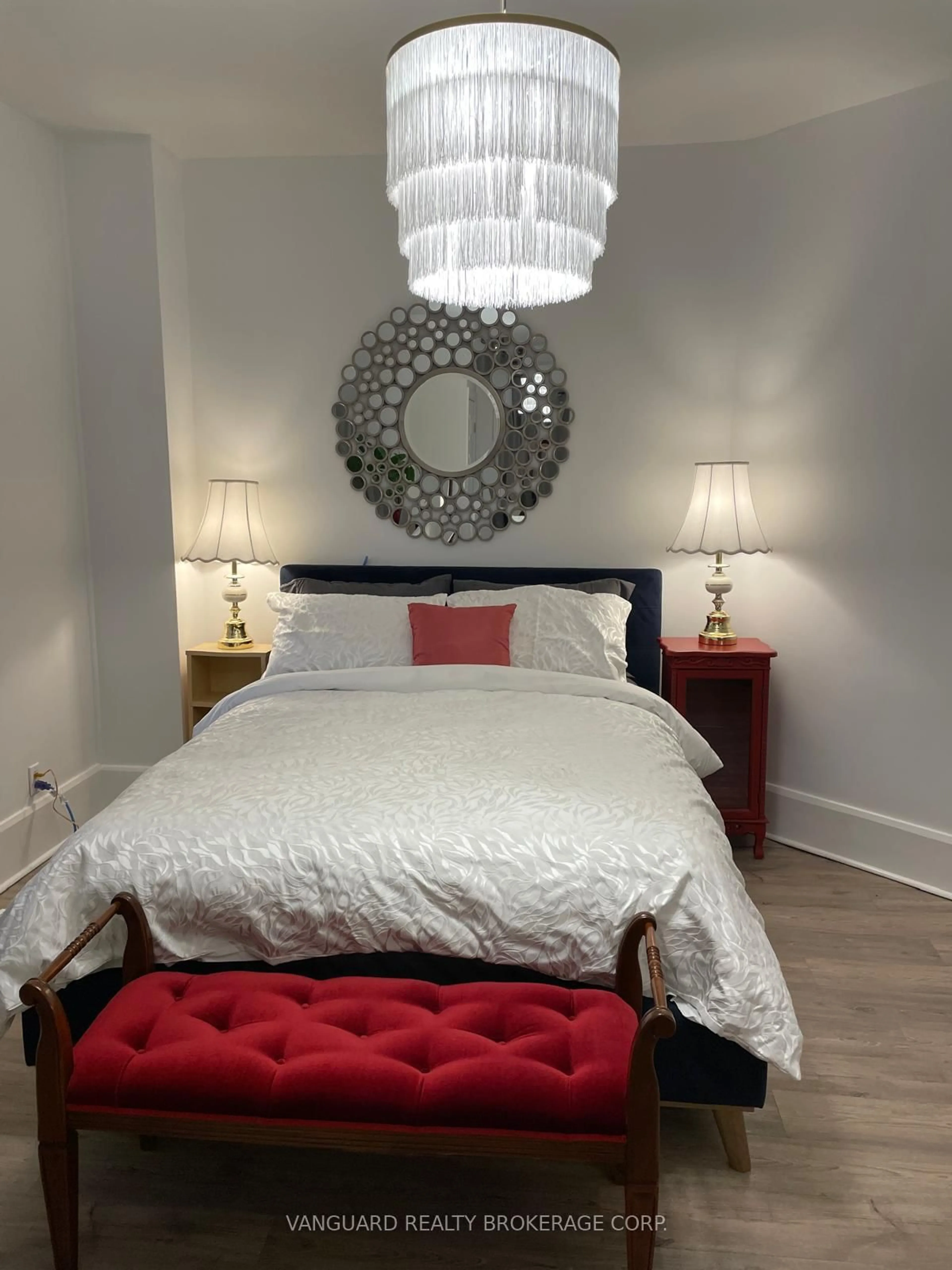 Bedroom with bed, wood/laminate floor for 71 John St, Bradford West Gwillimbury Ontario L3Z 1G3