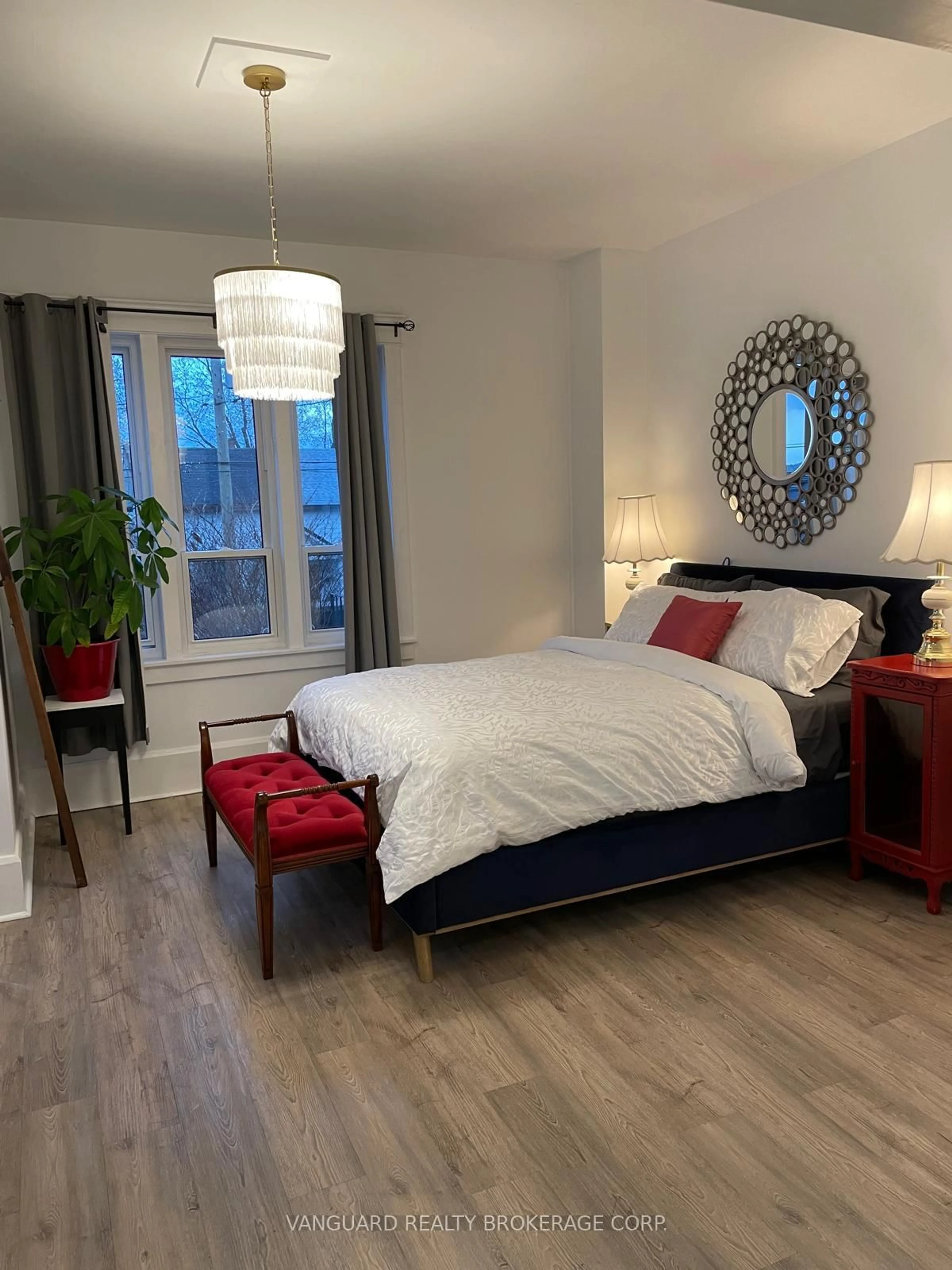 Bedroom with bed, wood/laminate floor for 71 John St, Bradford West Gwillimbury Ontario L3Z 1G3