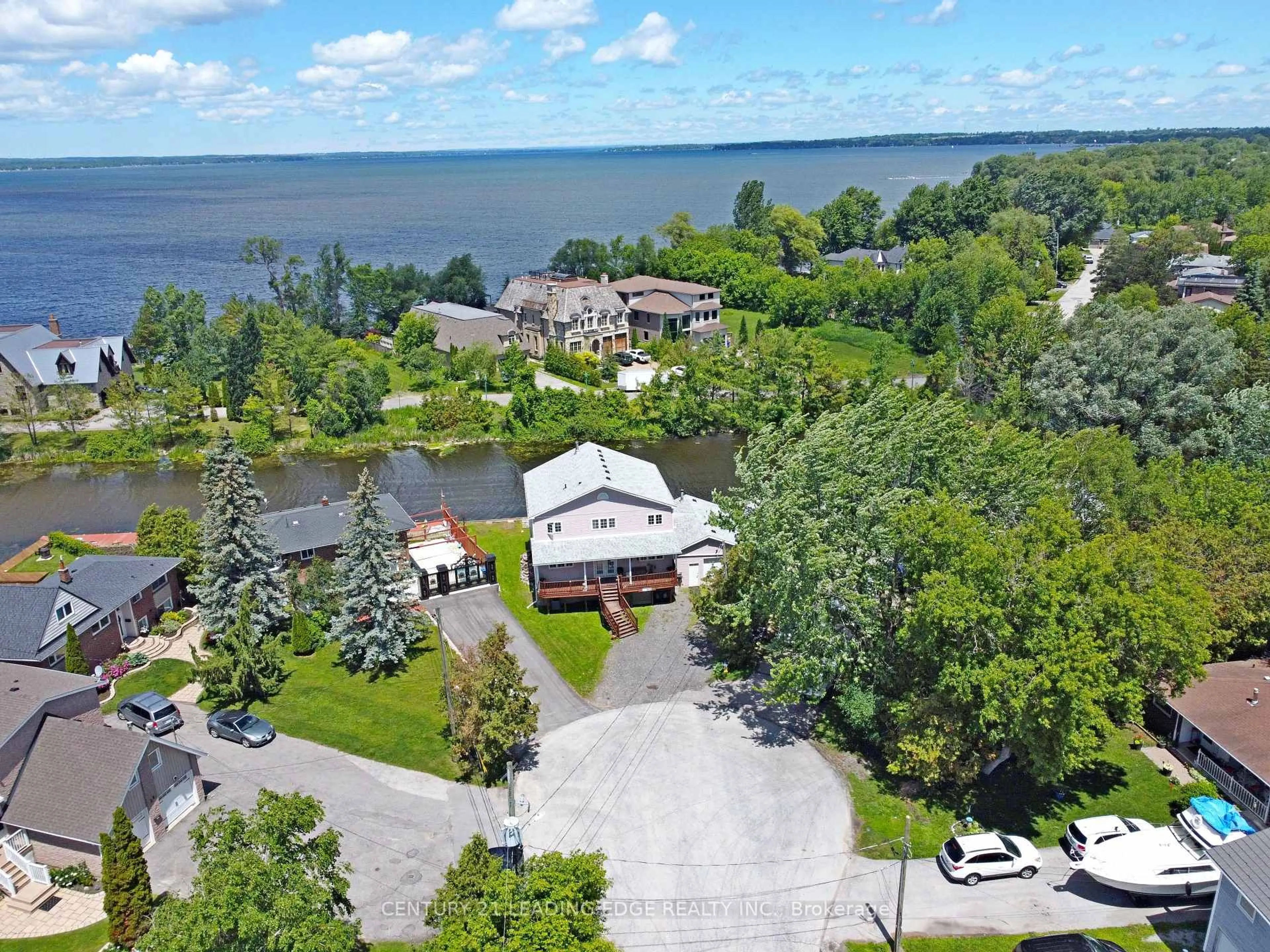 A pic from outside/outdoor area/front of a property/back of a property/a pic from drone, water/lake/river/ocean view for 27 Robert St, Georgina Ontario L4P 1K7