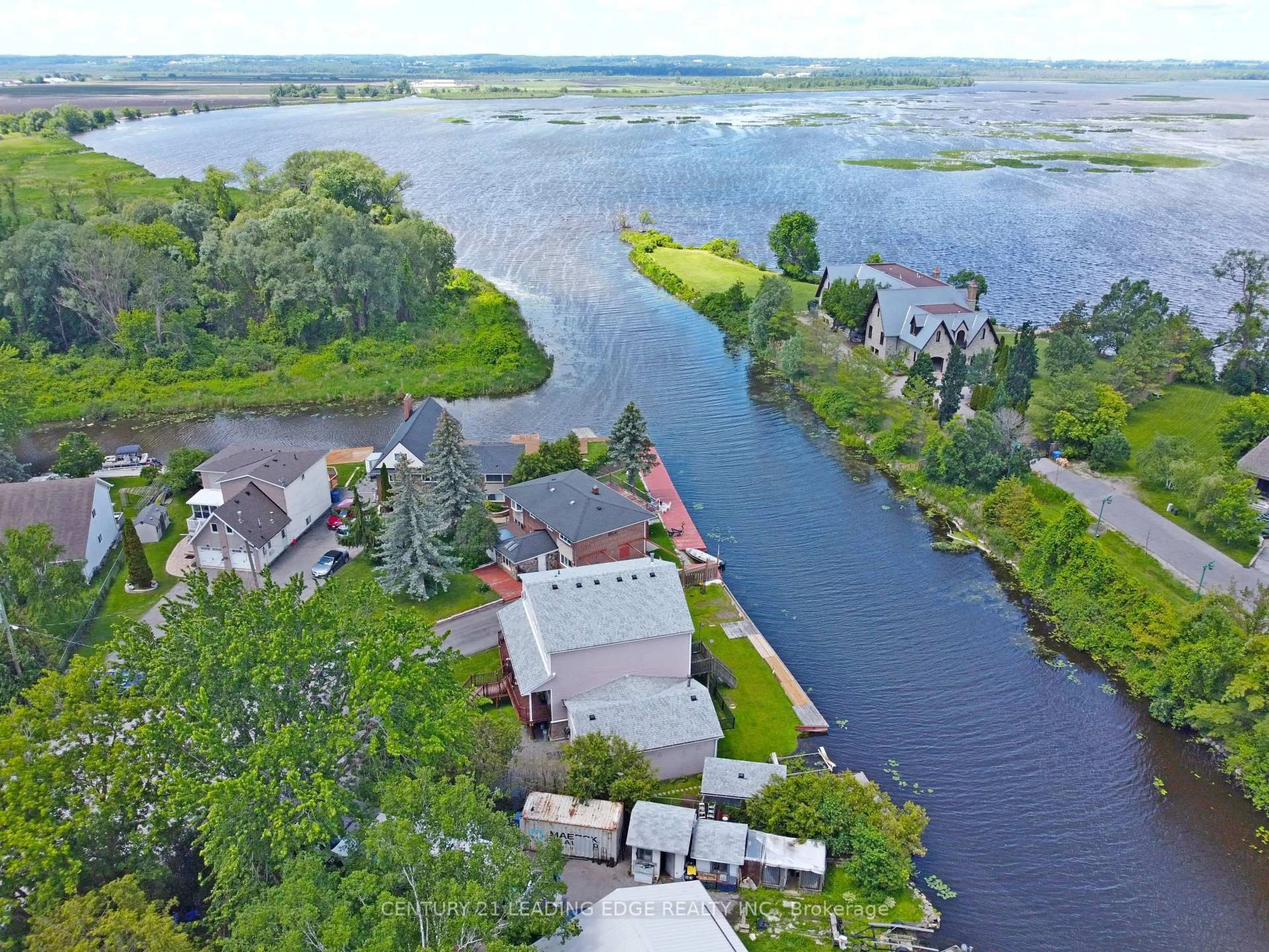 A pic from outside/outdoor area/front of a property/back of a property/a pic from drone, water/lake/river/ocean view for 27 Robert St, Georgina Ontario L4P 1K7