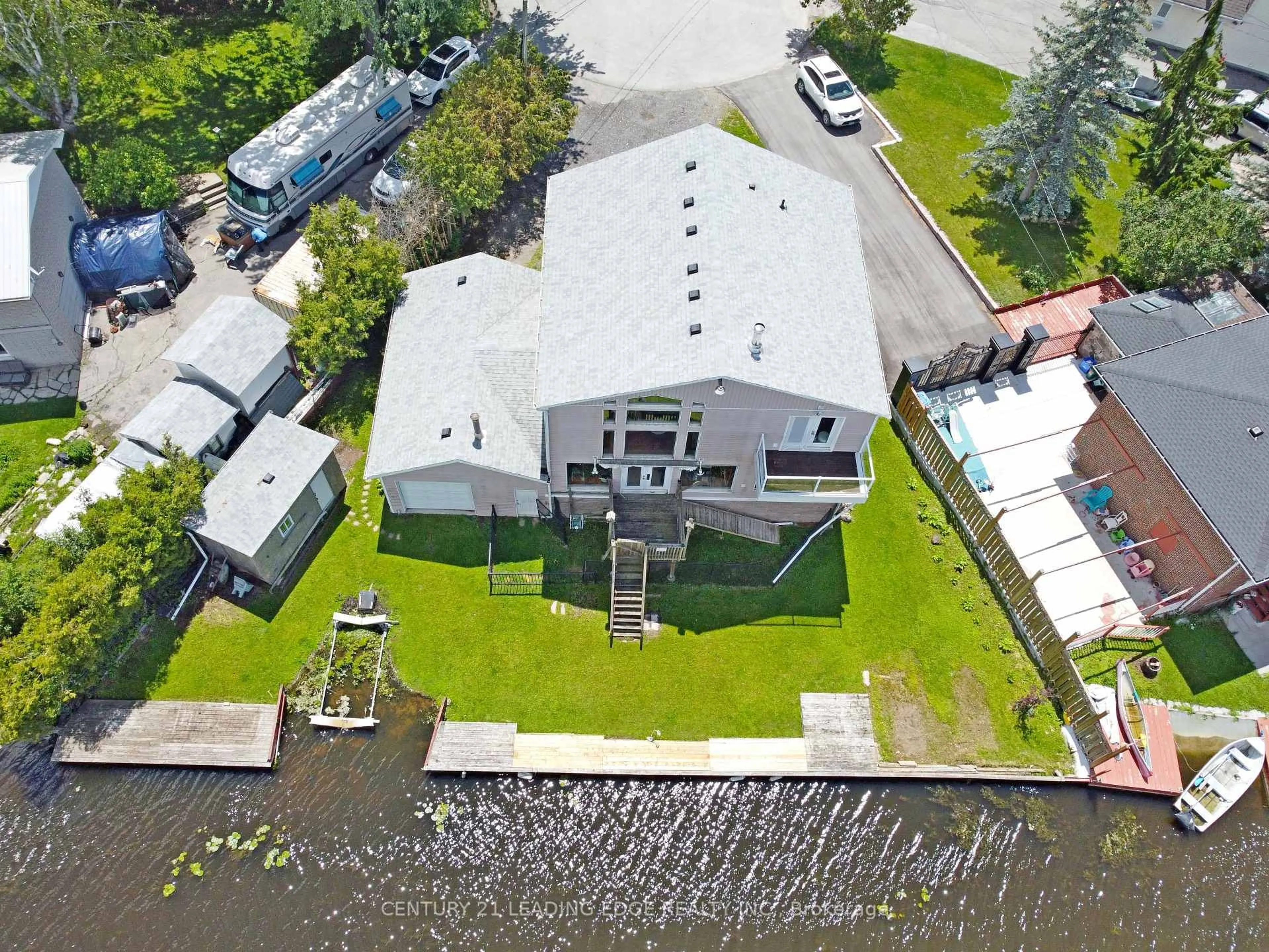 A pic from outside/outdoor area/front of a property/back of a property/a pic from drone, water/lake/river/ocean view for 27 Robert St, Georgina Ontario L4P 1K7