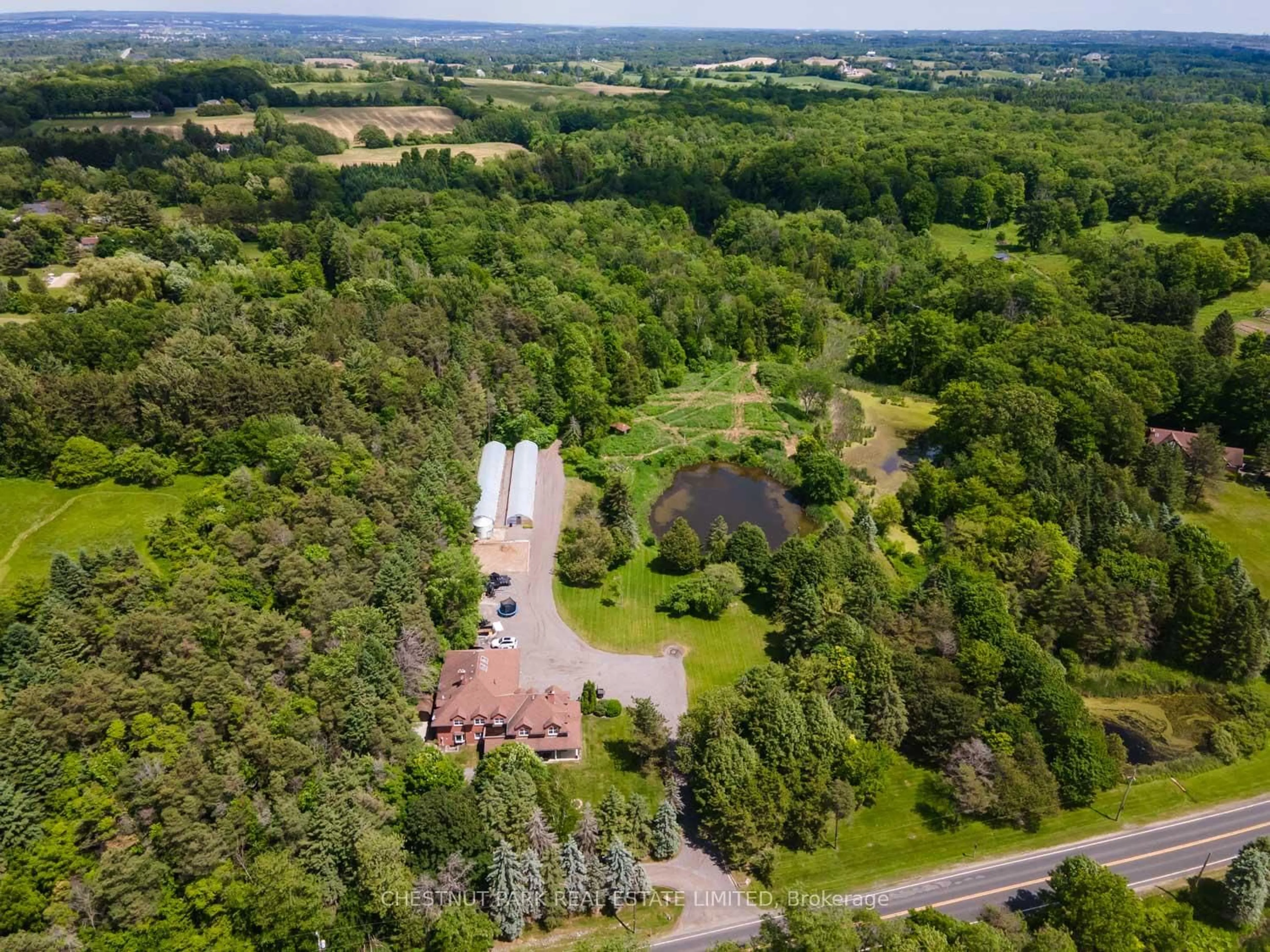 A pic from outside/outdoor area/front of a property/back of a property/a pic from drone, forest/trees view for 15175 Keele St, King Ontario L7B 1A3