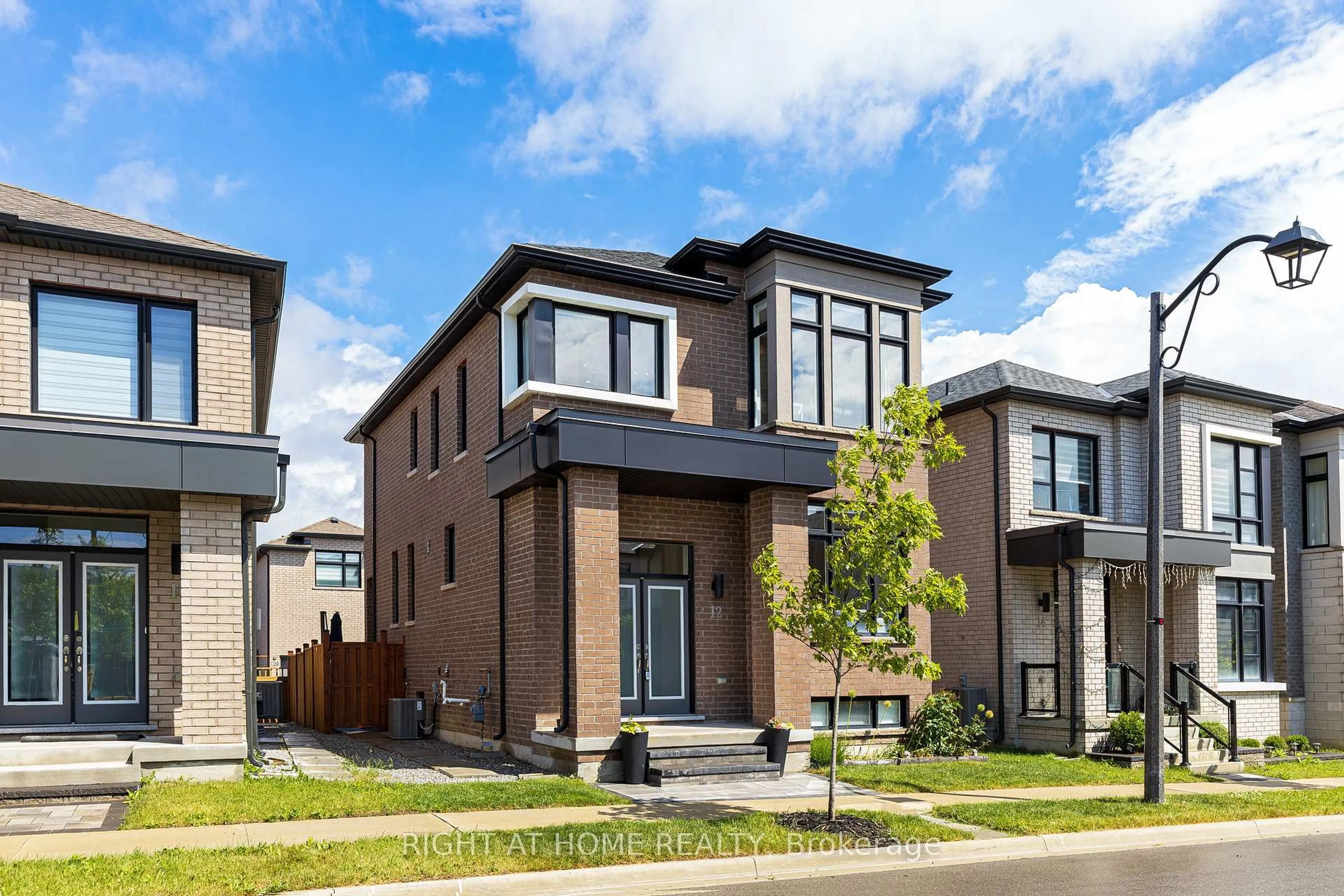 Home with brick exterior material, street for 12 Sam Priestley Ave, Markham Ontario L6B 1P1