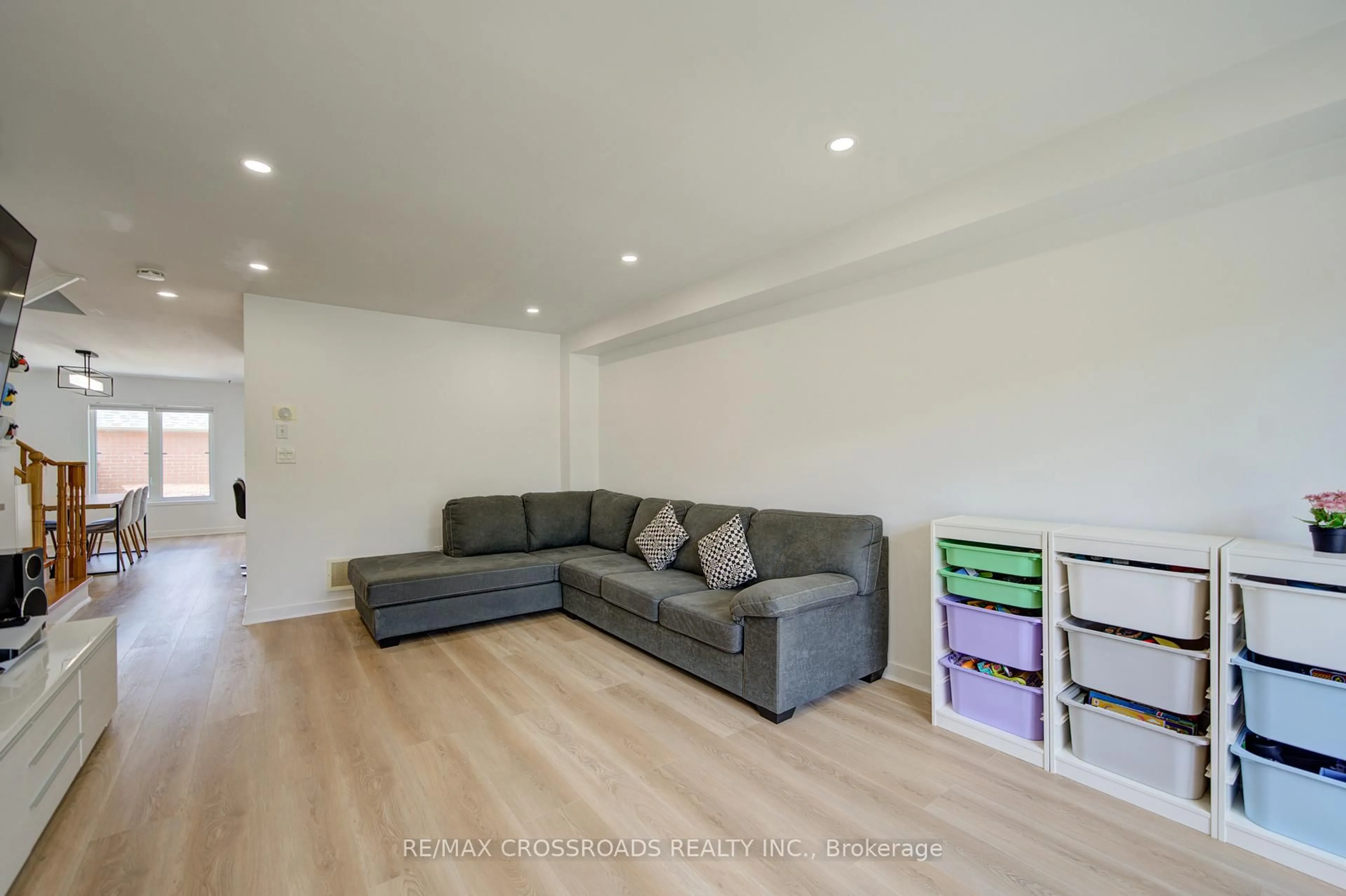 Living room with furniture, wood/laminate floor for 2278 Bur Oak Ave, Markham Ontario L6E 1M1