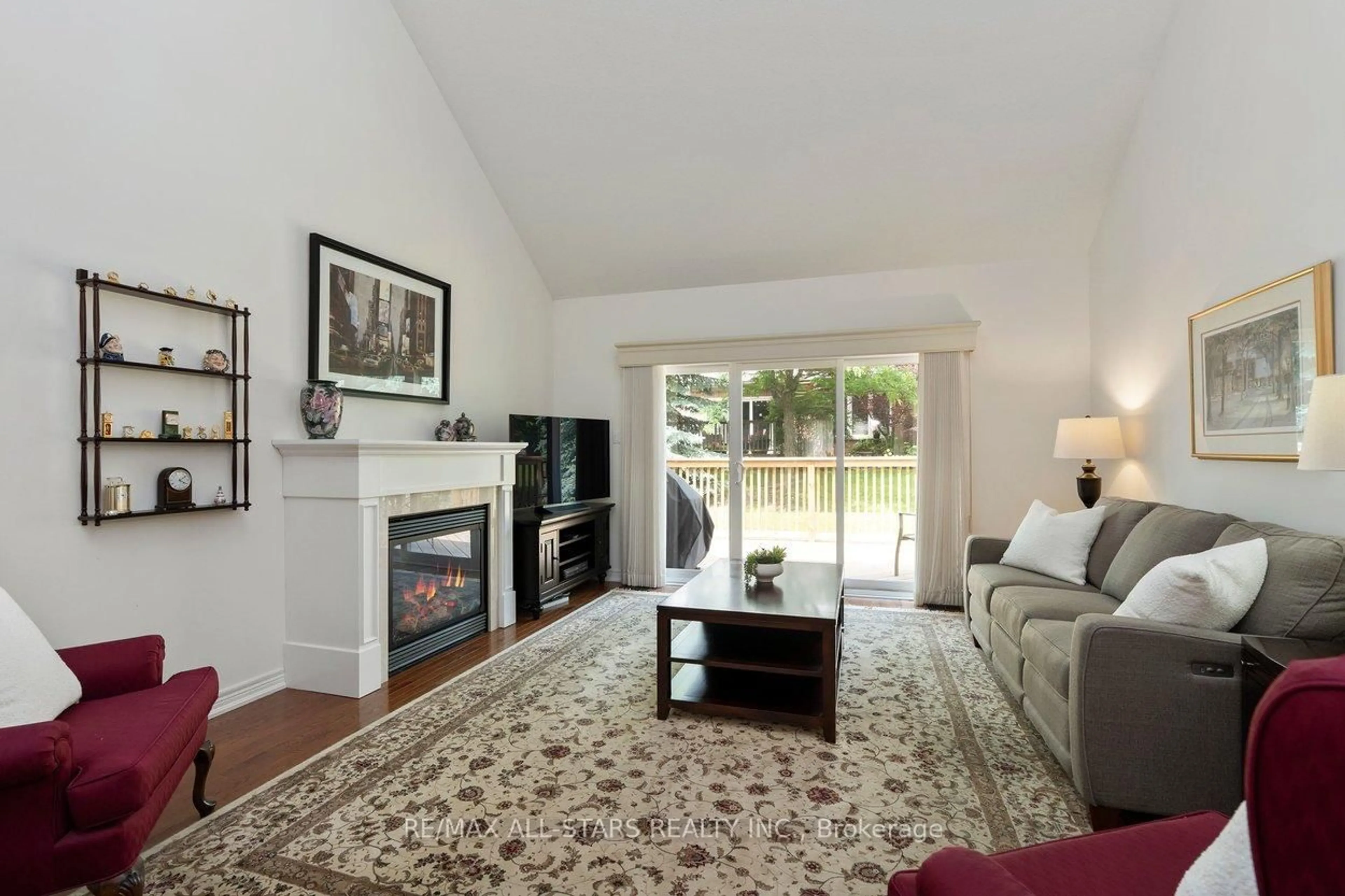 Living room with furniture, wood/laminate floor for 52 Oasis Way, Markham Ontario L6E 0B6