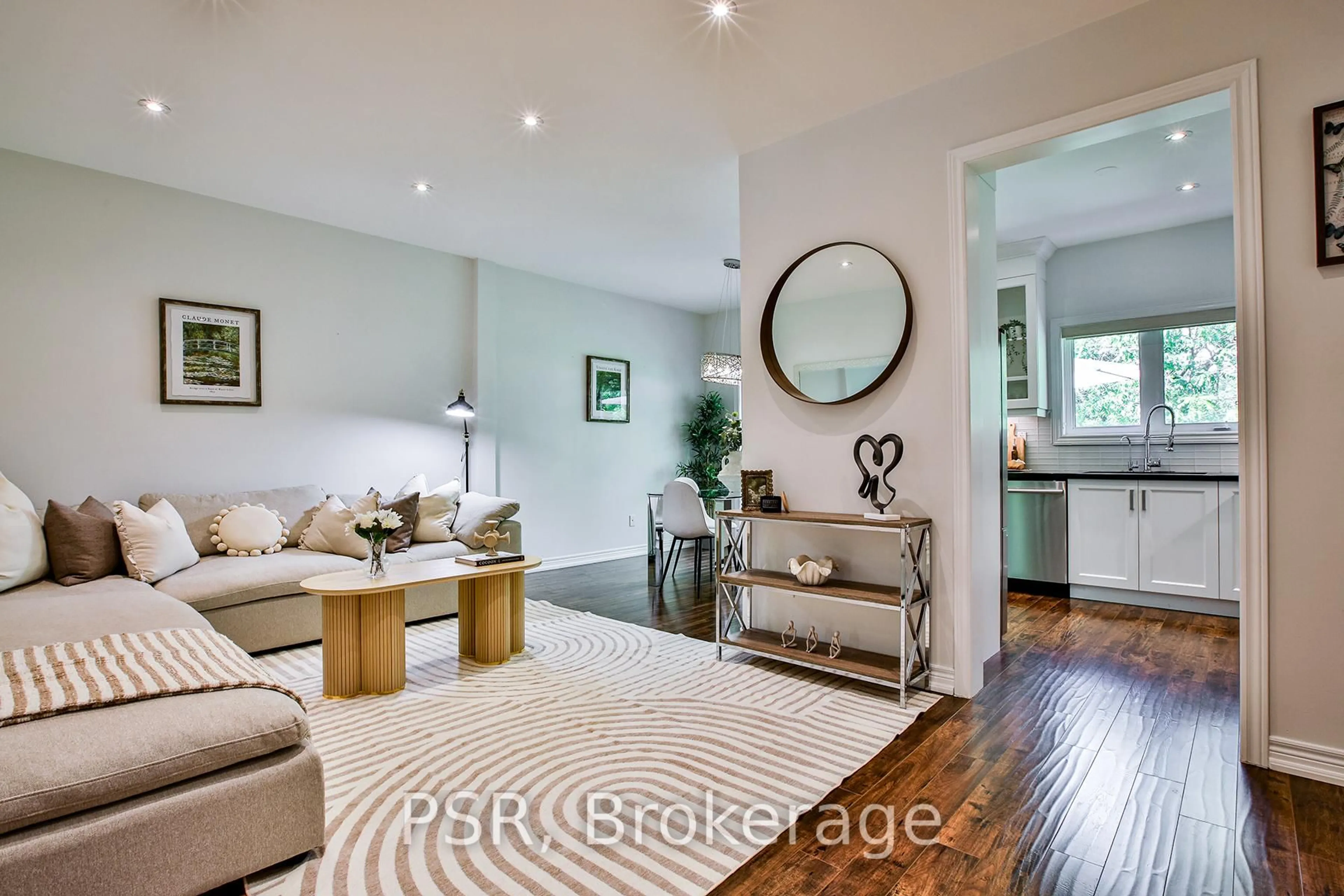 Living room with furniture, wood/laminate floor for 715 John Cole Crt, Newmarket Ontario L3Y 5V7