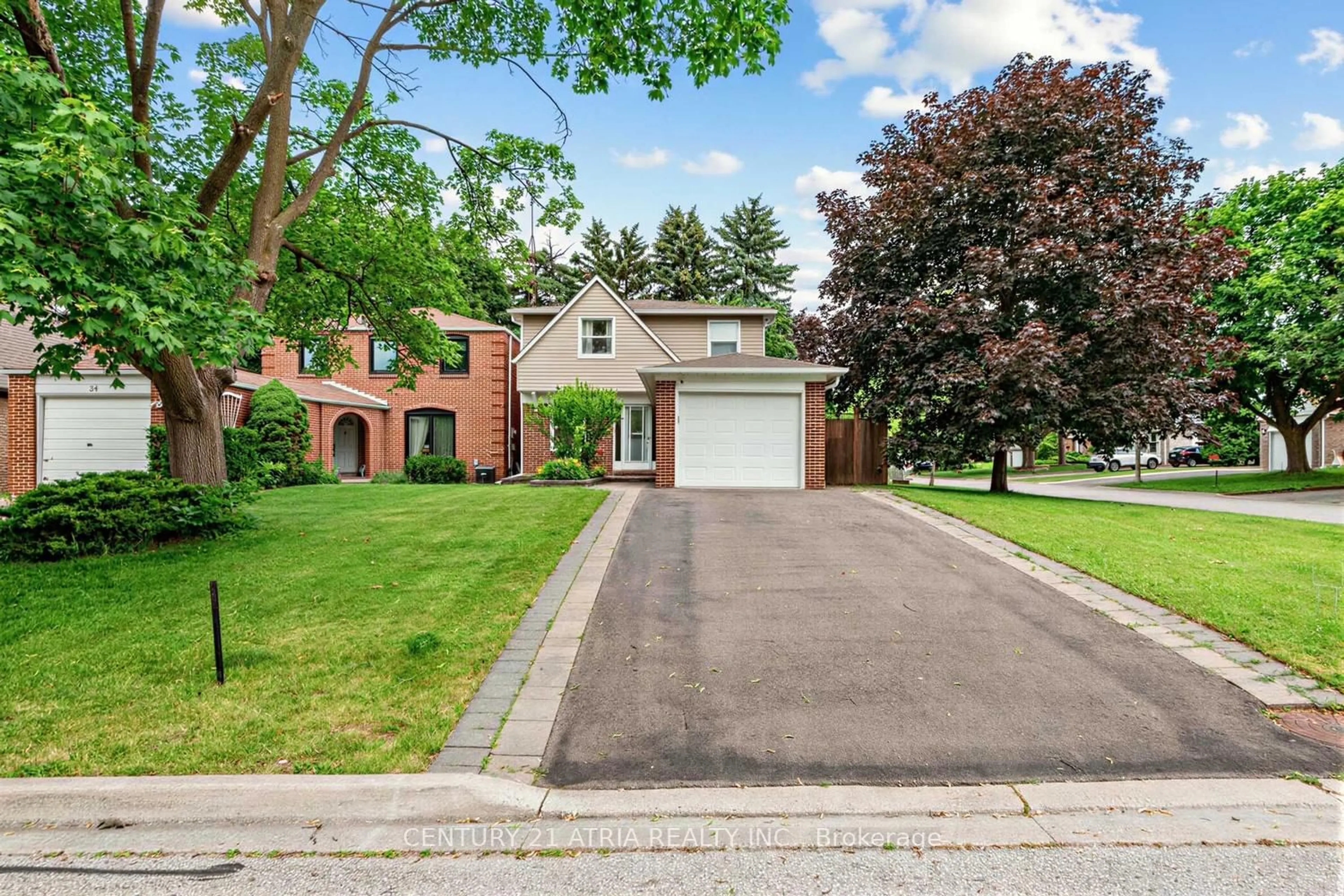 Home with brick exterior material, street for 36 Ravengloss Dr, Markham Ontario L3T 4C9