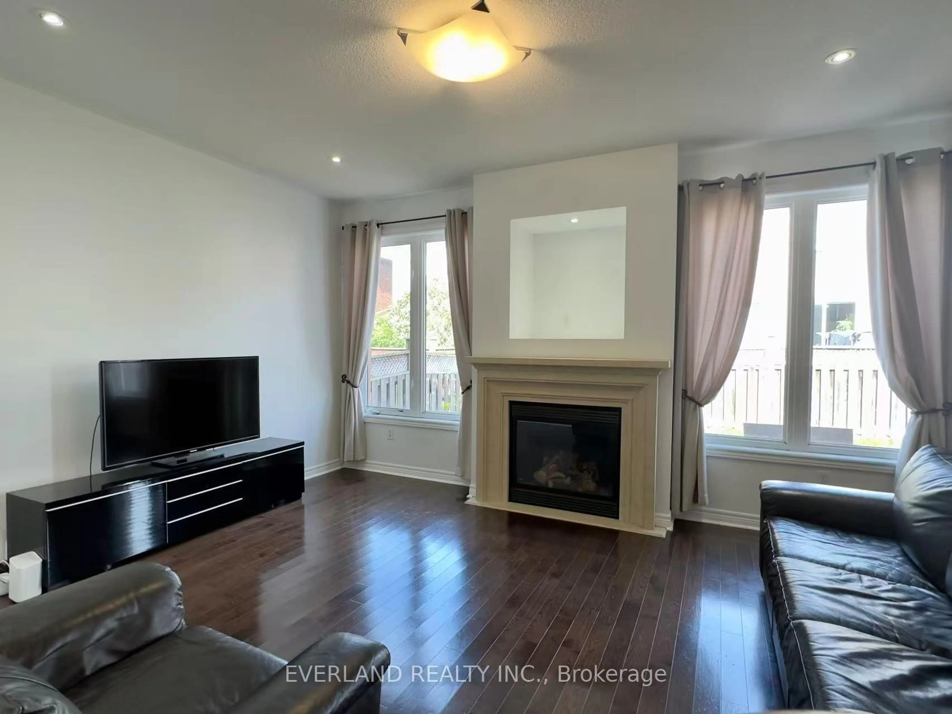 Living room with furniture, wood/laminate floor for 22 Lundy Dr, Markham Ontario L6B 0G1