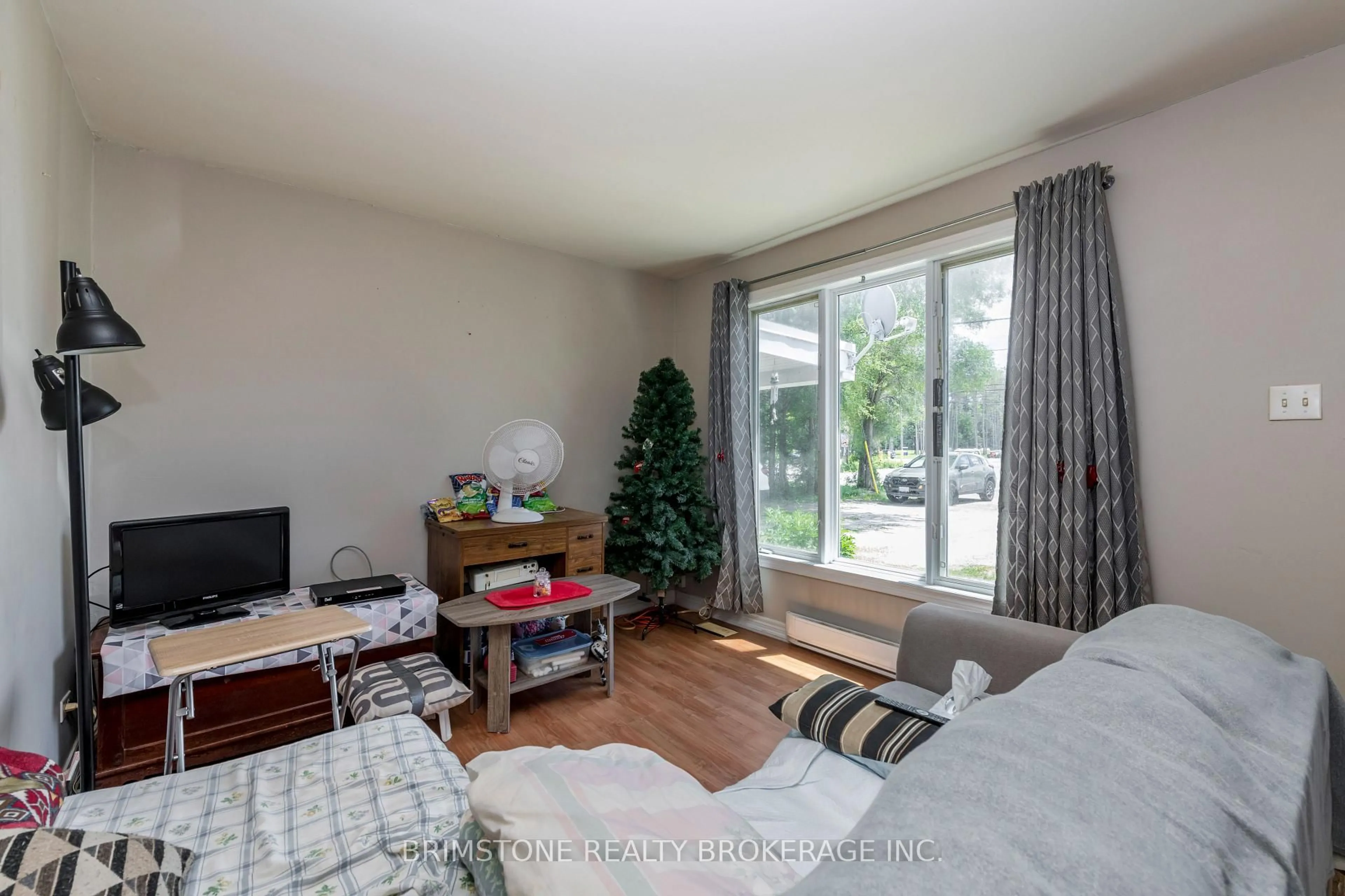 Living room with furniture, wood/laminate floor for 24 Brentwood Rd, Essa Ontario L0M 1B2