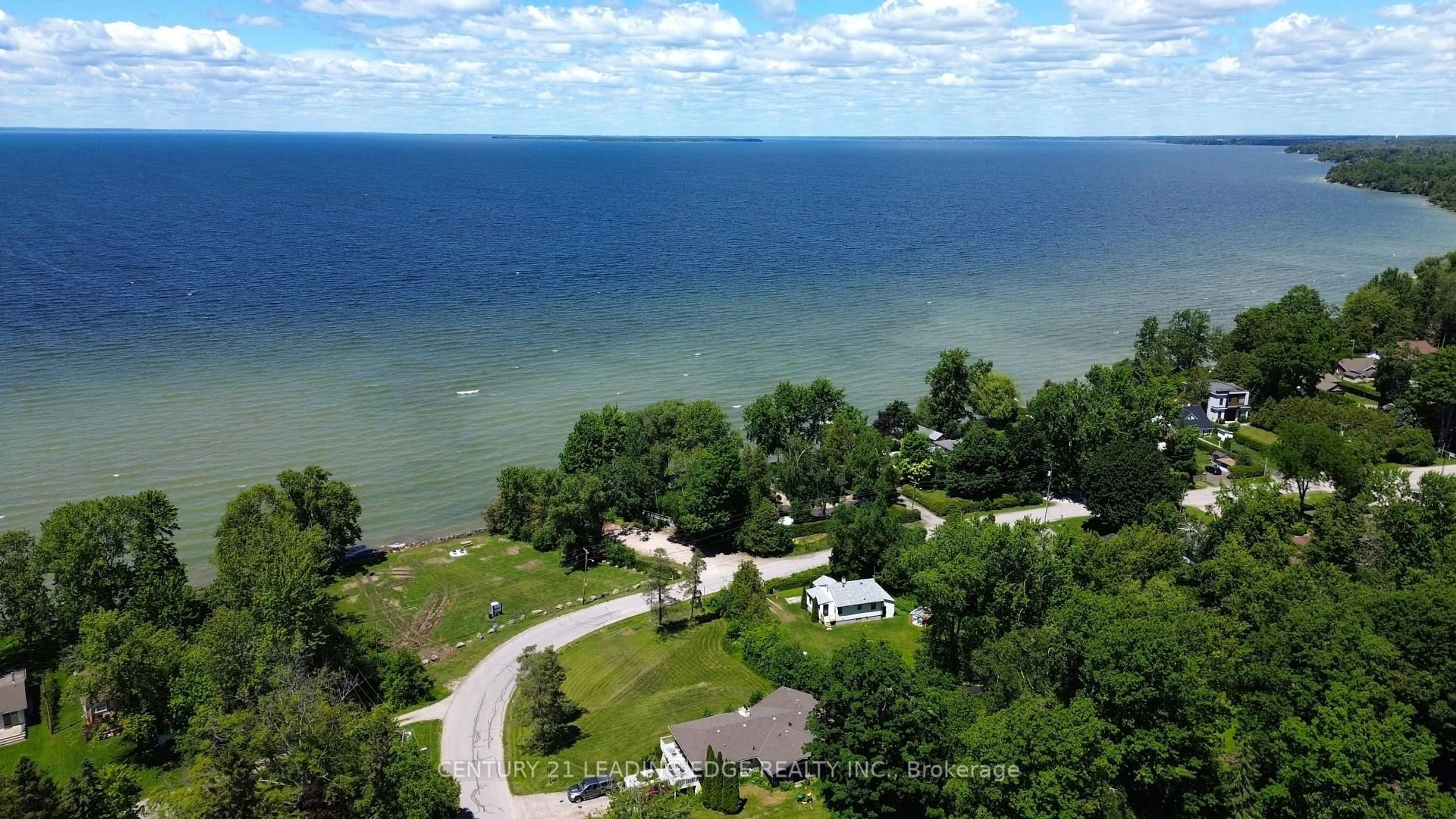 A pic from outside/outdoor area/front of a property/back of a property/a pic from drone, water/lake/river/ocean view for 101 Clovelly Cove, Georgina Ontario L0E 1E0