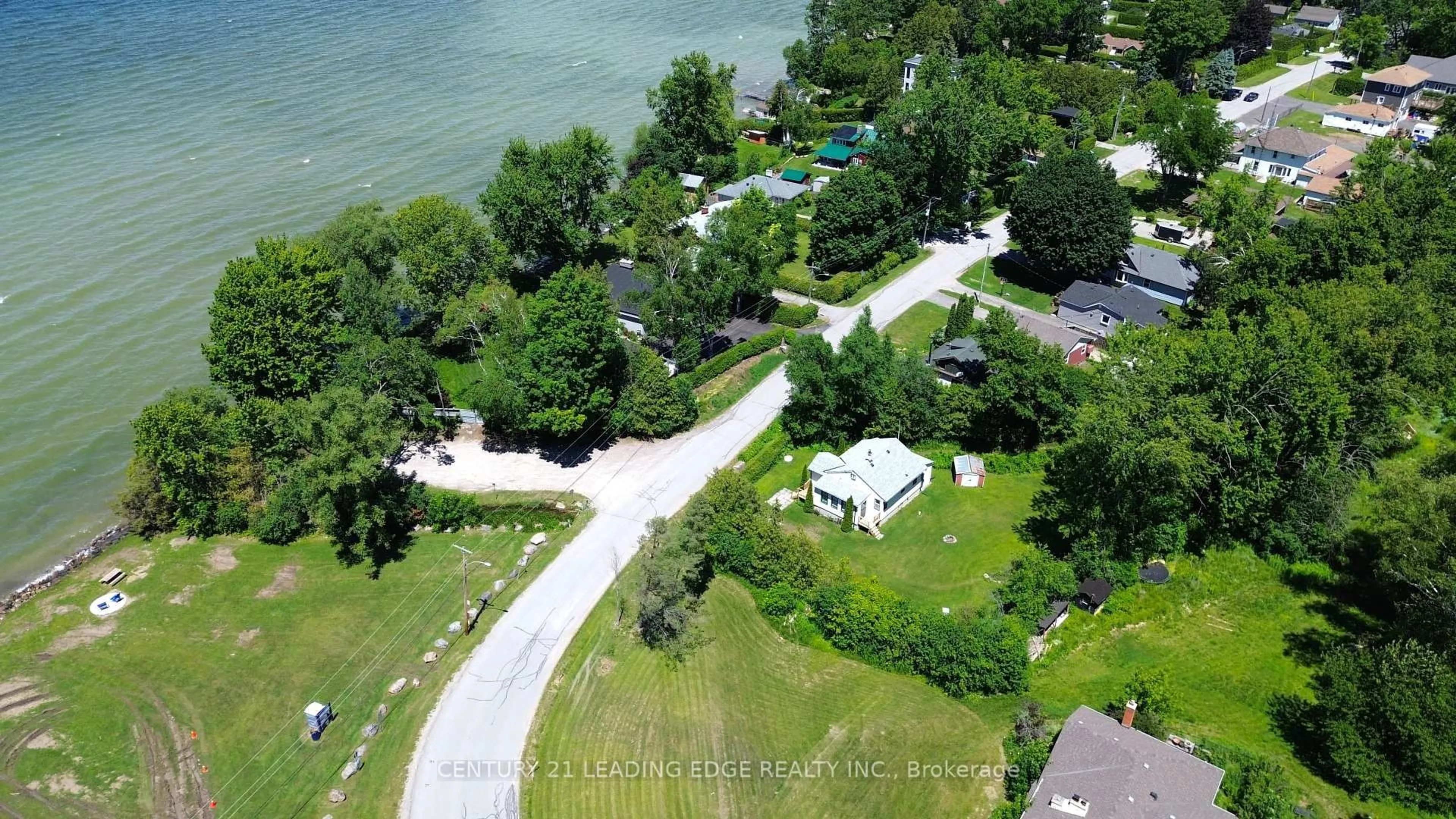 A pic from outside/outdoor area/front of a property/back of a property/a pic from drone, water/lake/river/ocean view for 101 Clovelly Cove, Georgina Ontario L0E 1E0
