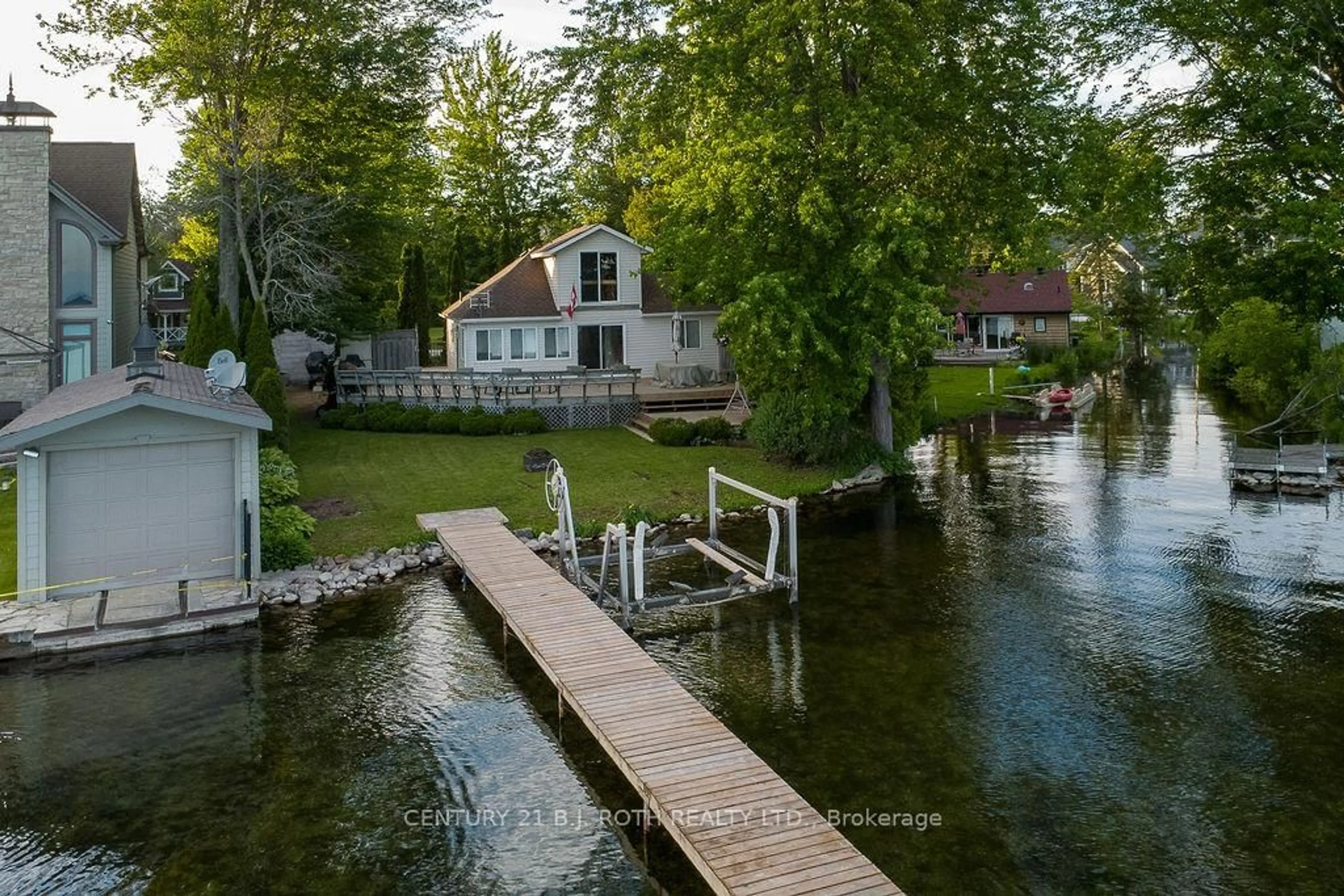 A pic from outside/outdoor area/front of a property/back of a property/a pic from drone, water/lake/river/ocean view for 2389 Crystal Beach Rd, Innisfil Ontario L9S 3W8