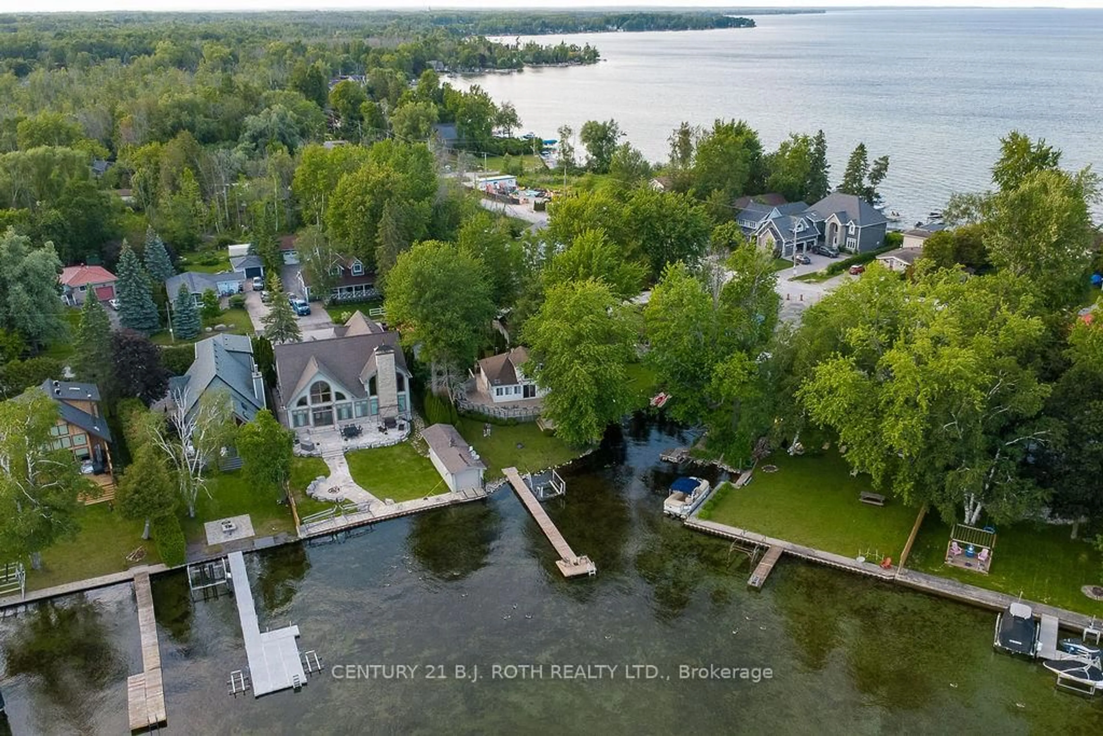 A pic from outside/outdoor area/front of a property/back of a property/a pic from drone, water/lake/river/ocean view for 2389 Crystal Beach Rd, Innisfil Ontario L9S 3W8