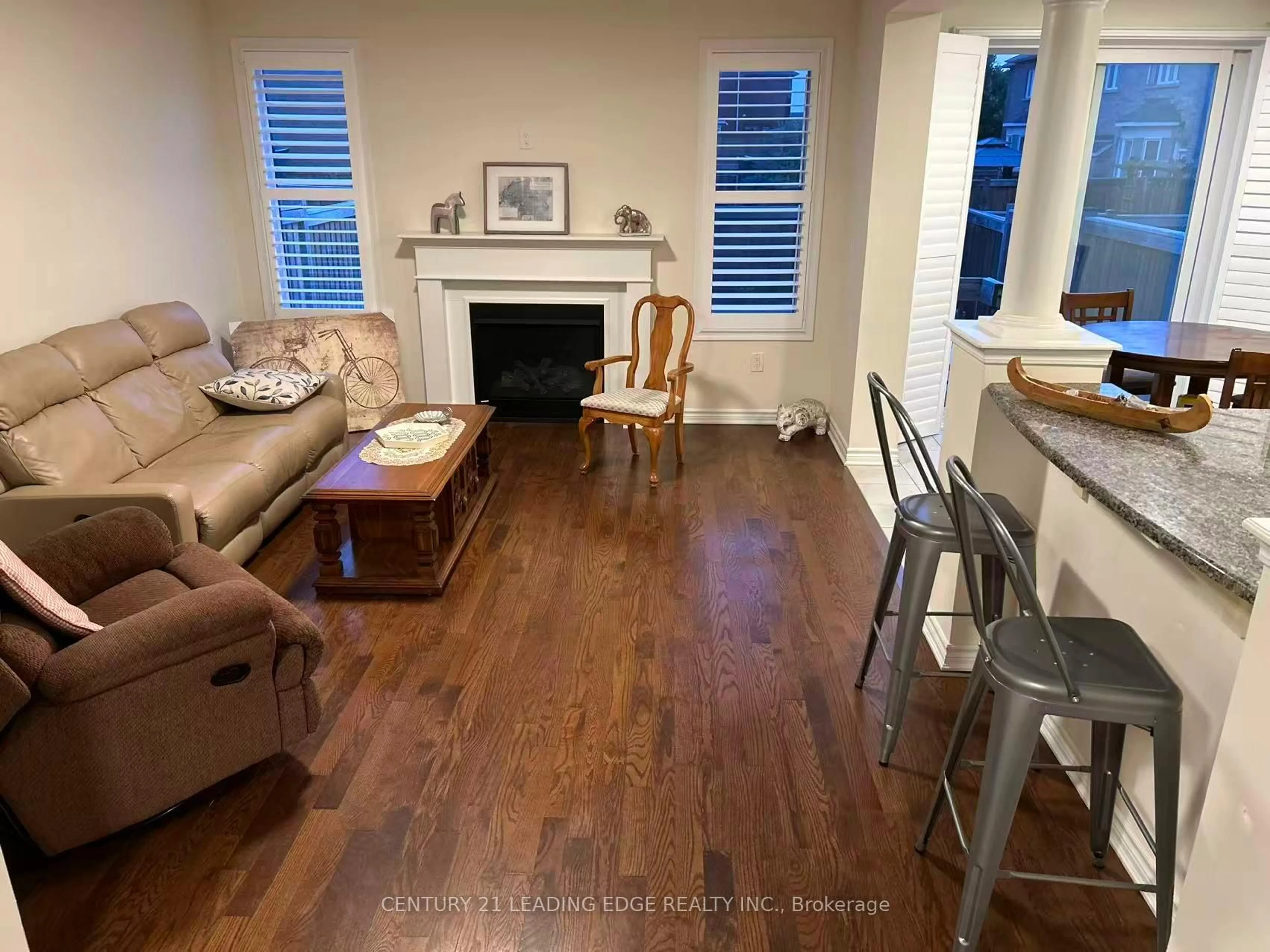 Living room with furniture, wood/laminate floor for 209 Baber Cres, Aurora Ontario L4G 0Y6