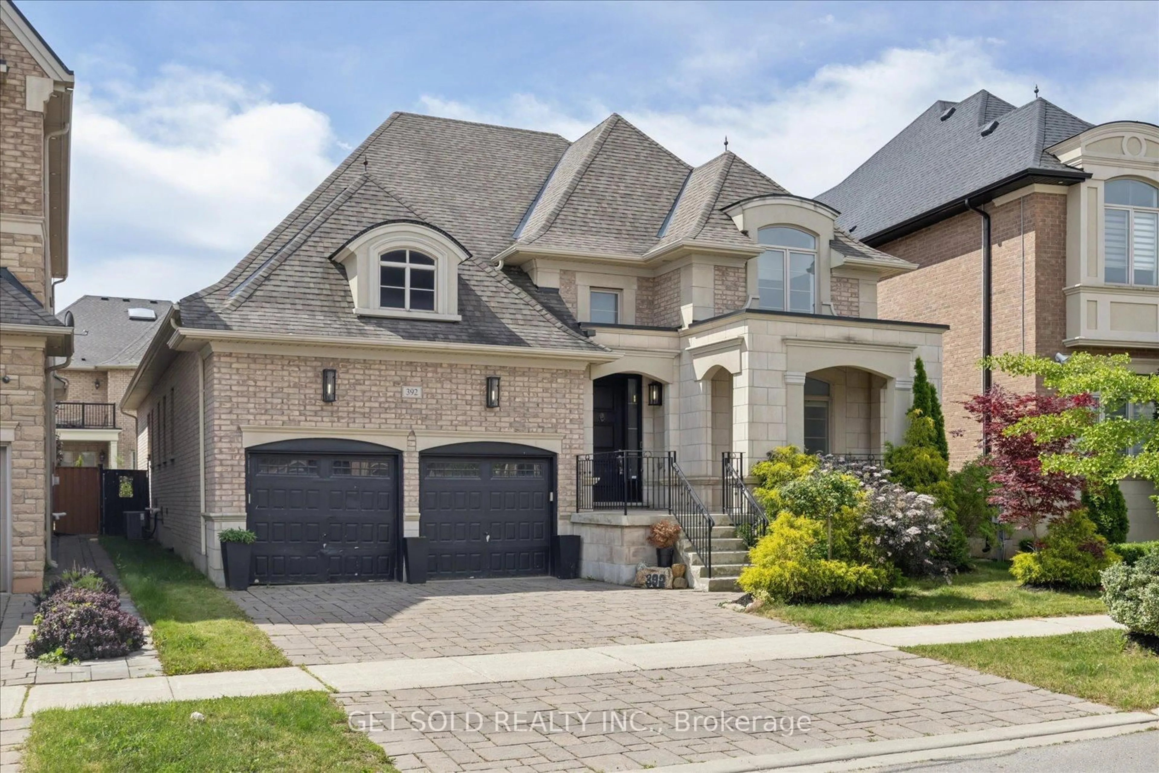 Home with brick exterior material, street for 392 Woodgate Pines Dr, Vaughan Ontario L4H 3X4