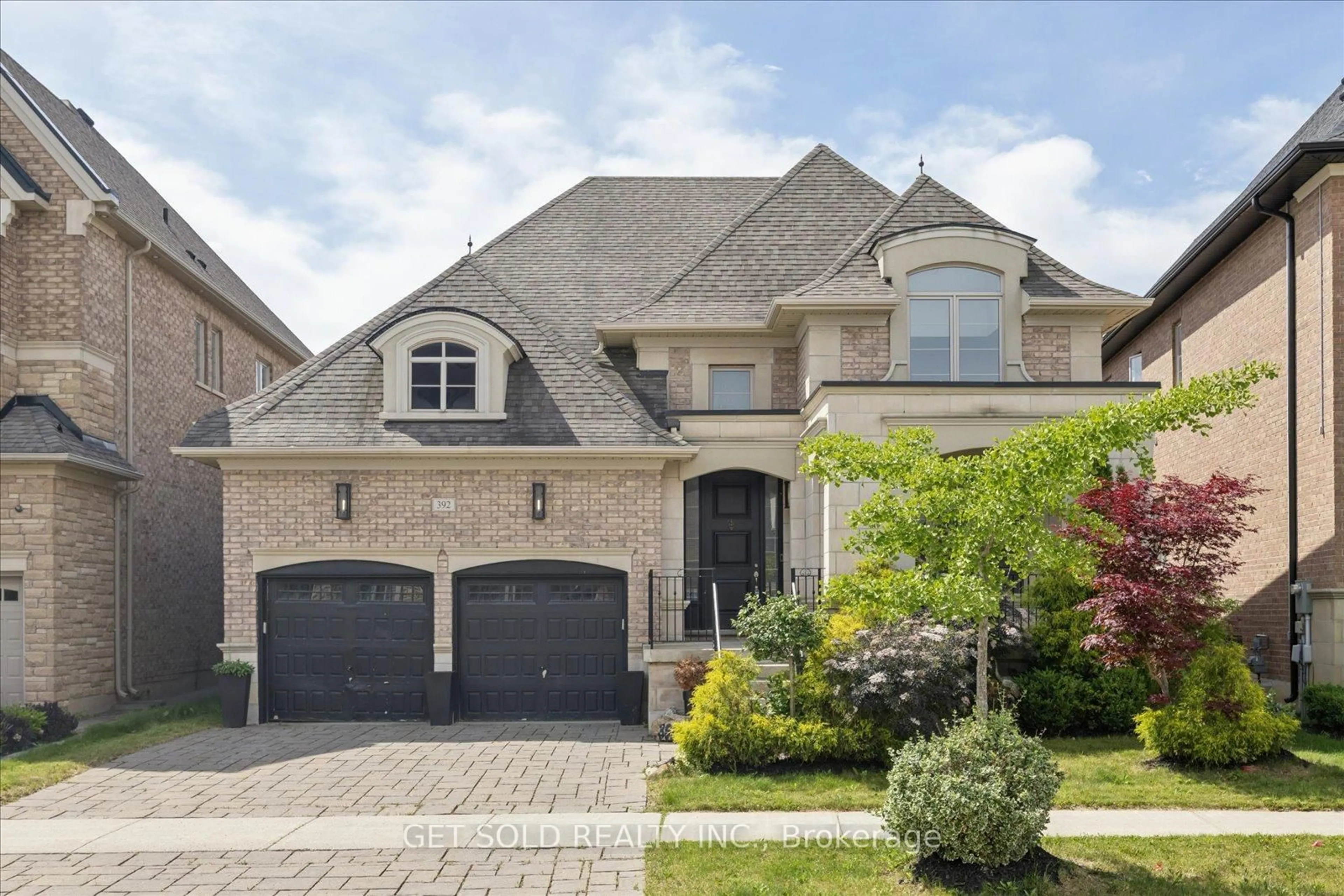 Home with brick exterior material, street for 392 Woodgate Pines Dr, Vaughan Ontario L4H 3X4