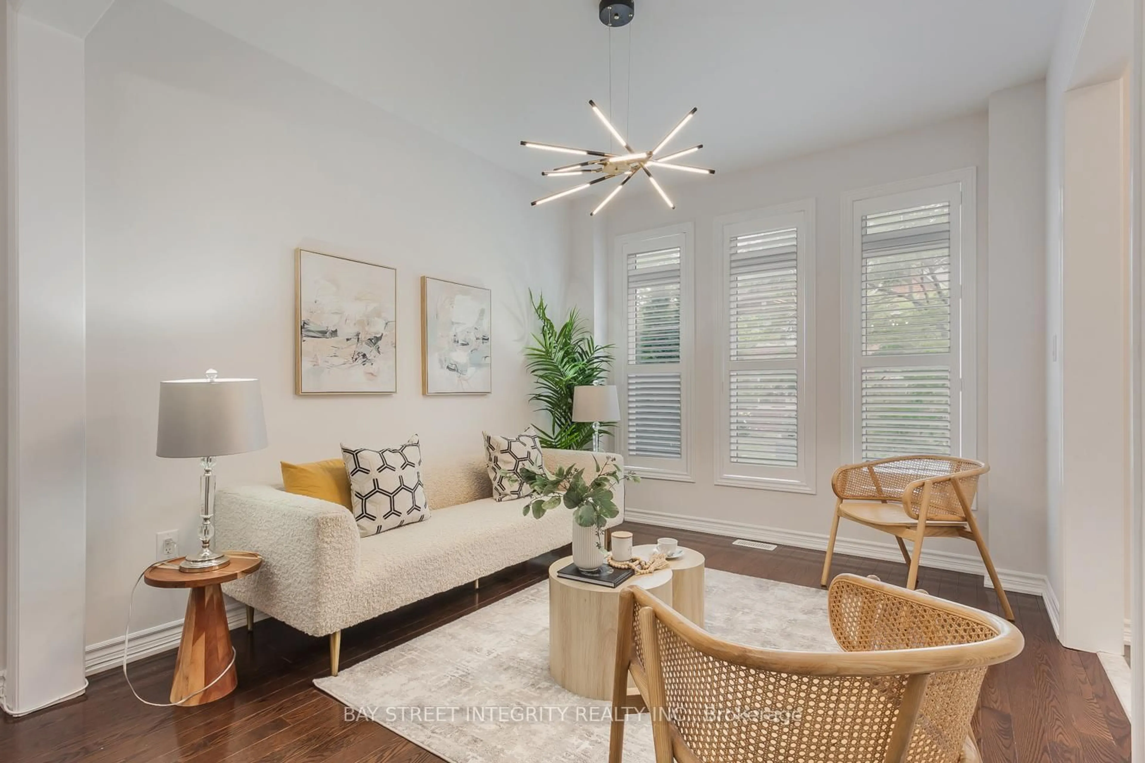 Living room with furniture, wood/laminate floor for 26 Carolina Rose Cres, Markham Ontario L6E 0P2