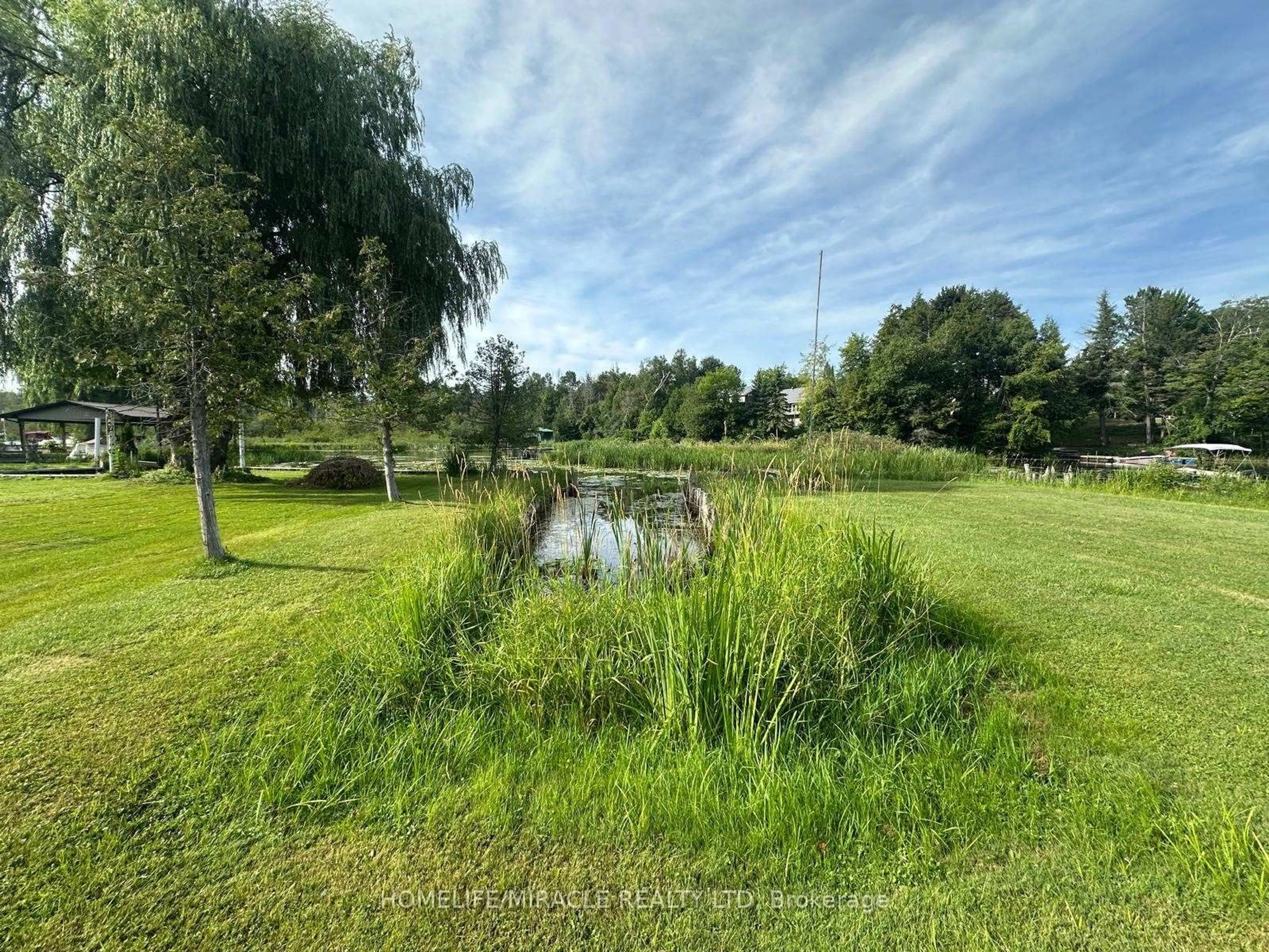 A pic from outside/outdoor area/front of a property/back of a property/a pic from drone, water/lake/river/ocean view for 164 RIVERBANK Dr, Georgina Ontario L0E 1N0