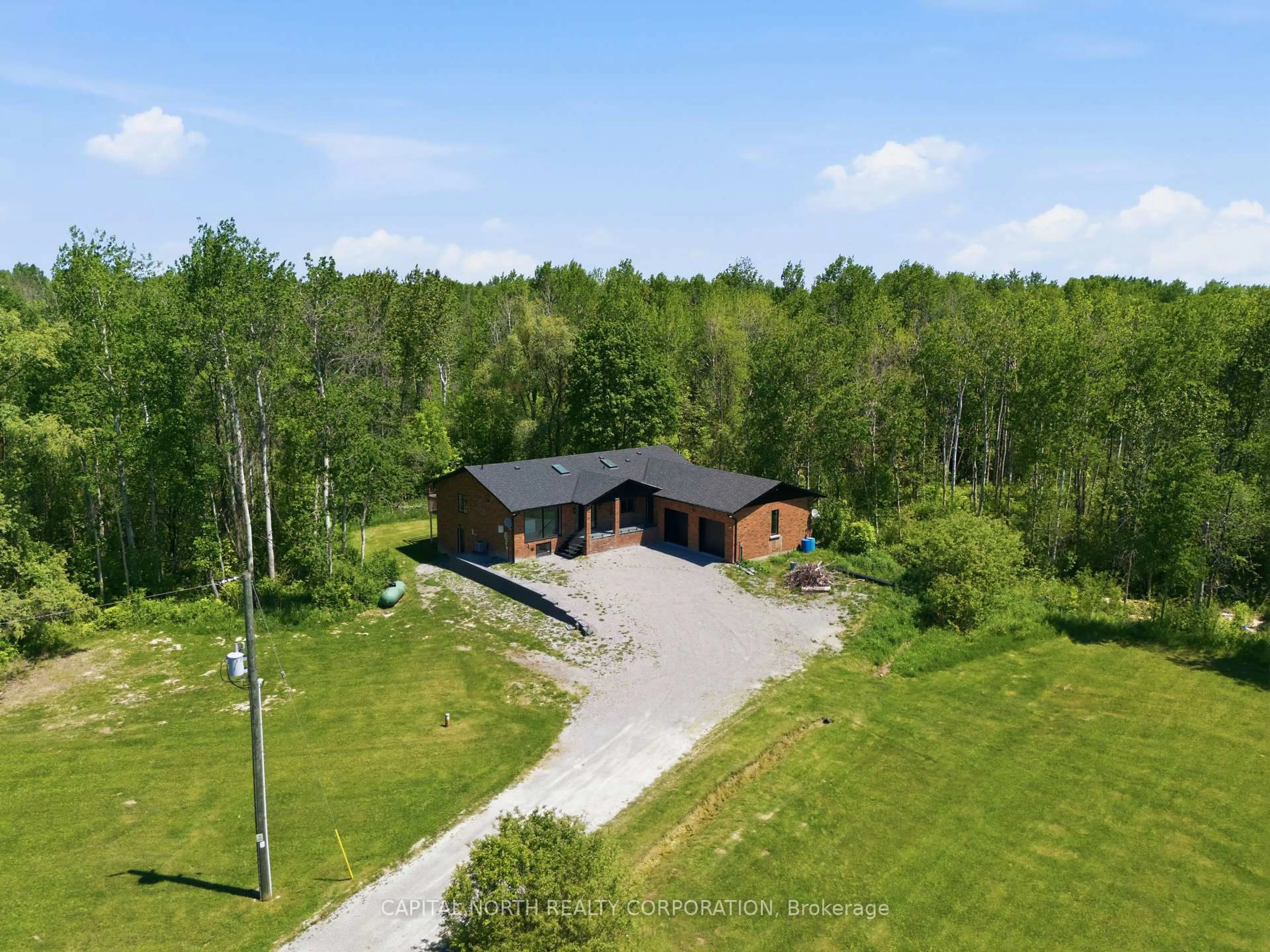 A pic from outside/outdoor area/front of a property/back of a property/a pic from drone, unknown for 26375 Woodbine Ave, Georgina Ontario L4P 3E9
