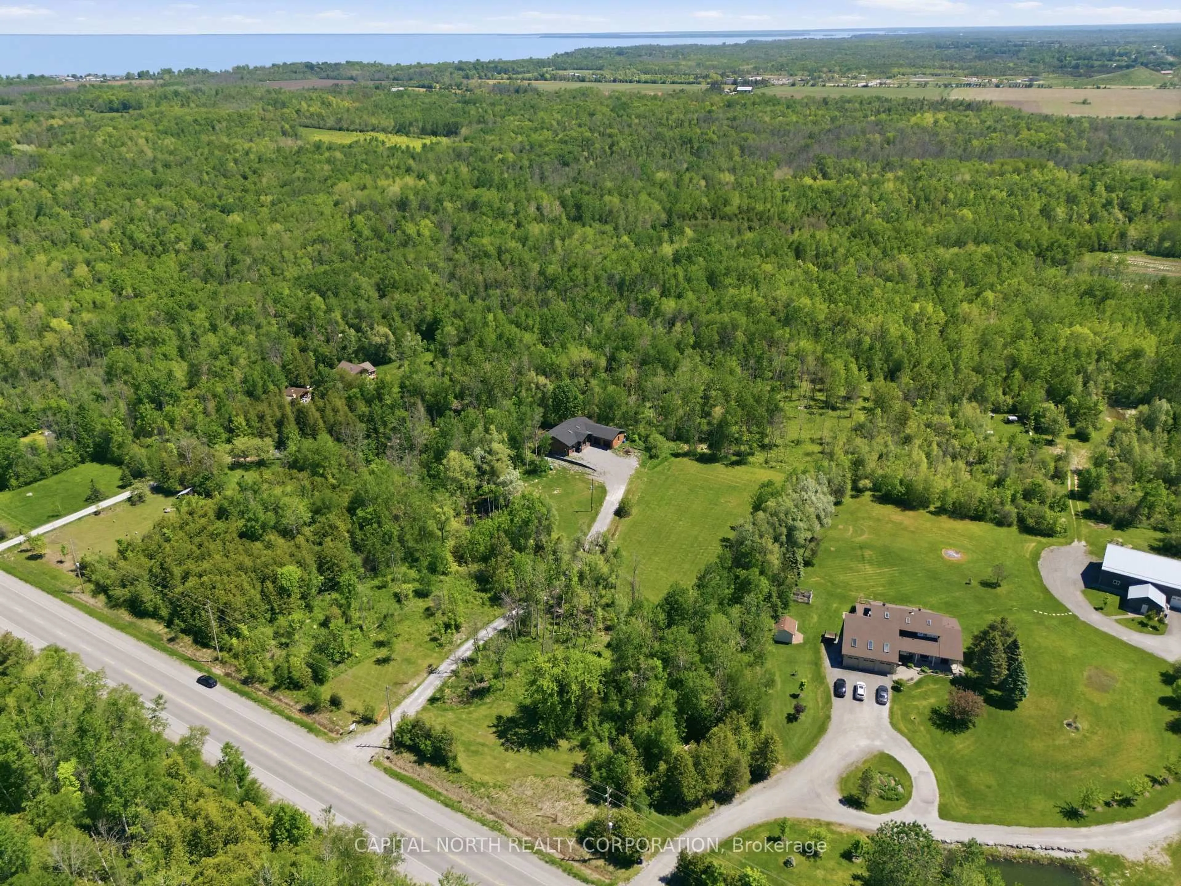 A pic from outside/outdoor area/front of a property/back of a property/a pic from drone, unknown for 26375 Woodbine Ave, Georgina Ontario L4P 3E9
