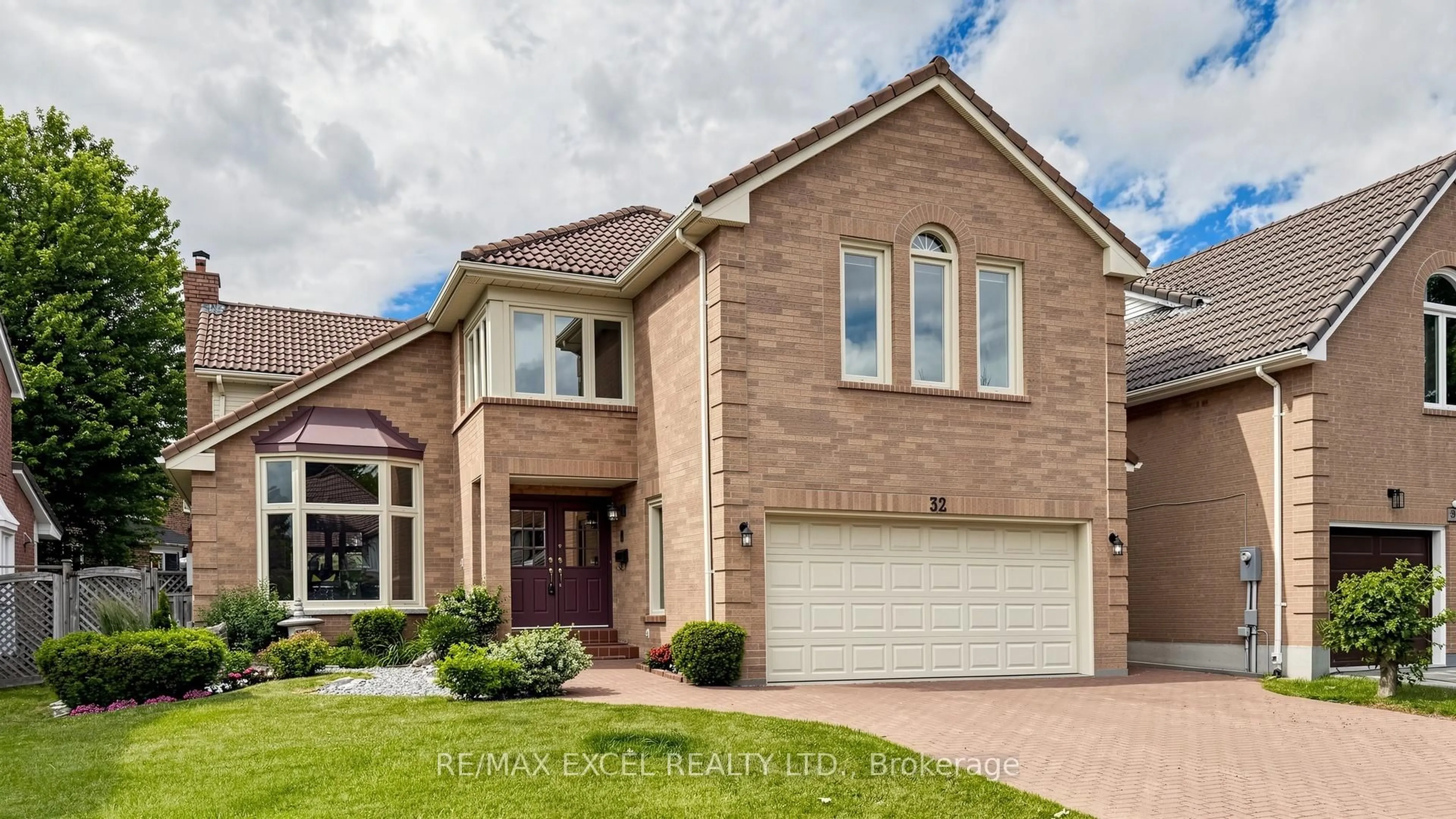 Home with brick exterior material, street for 32 Hollingham Rd, Markham Ontario L3R 7X4