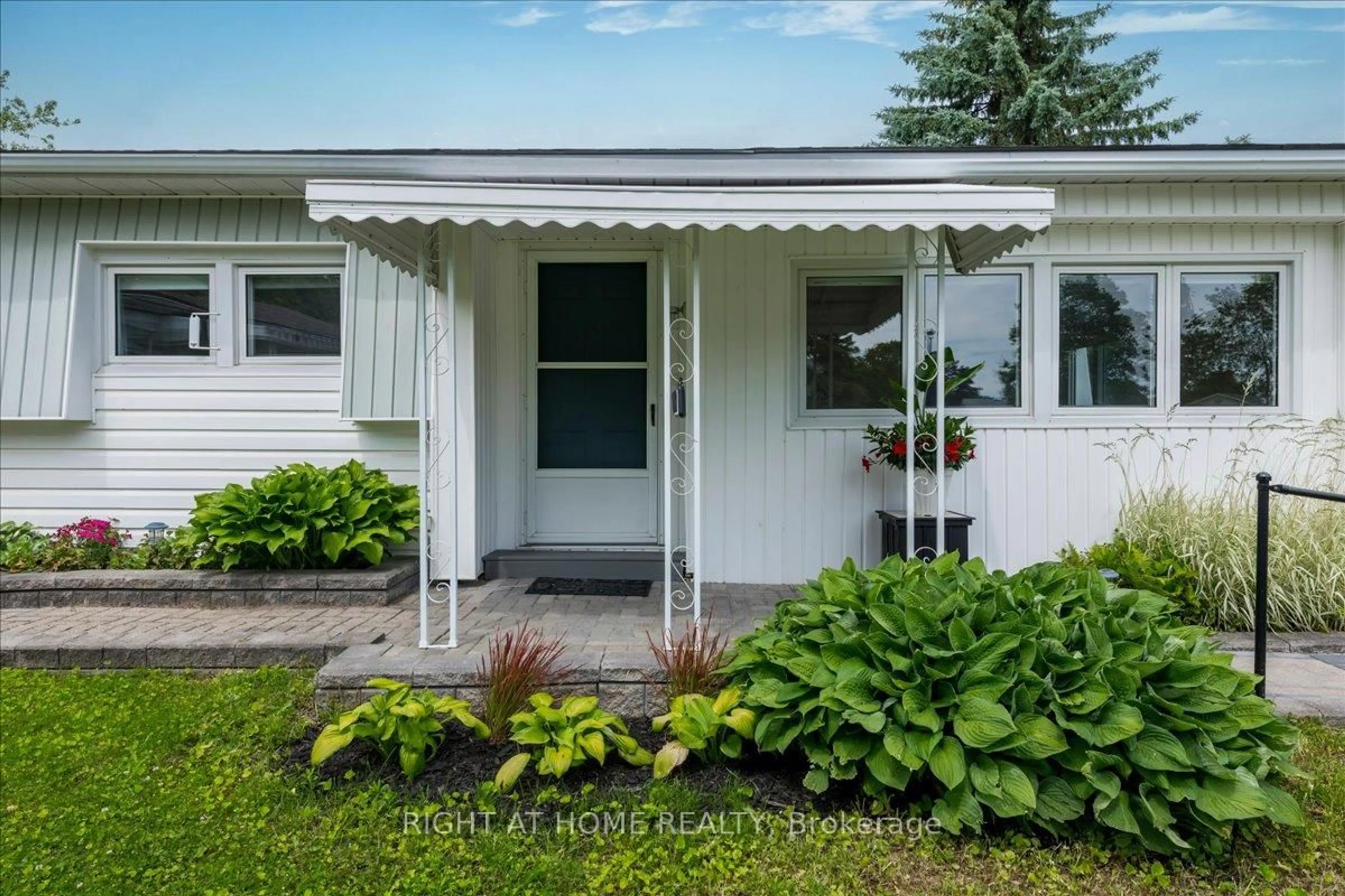 Home with vinyl exterior material, street for 15 Flora Dr, Innisfil Ontario L9S 1R3