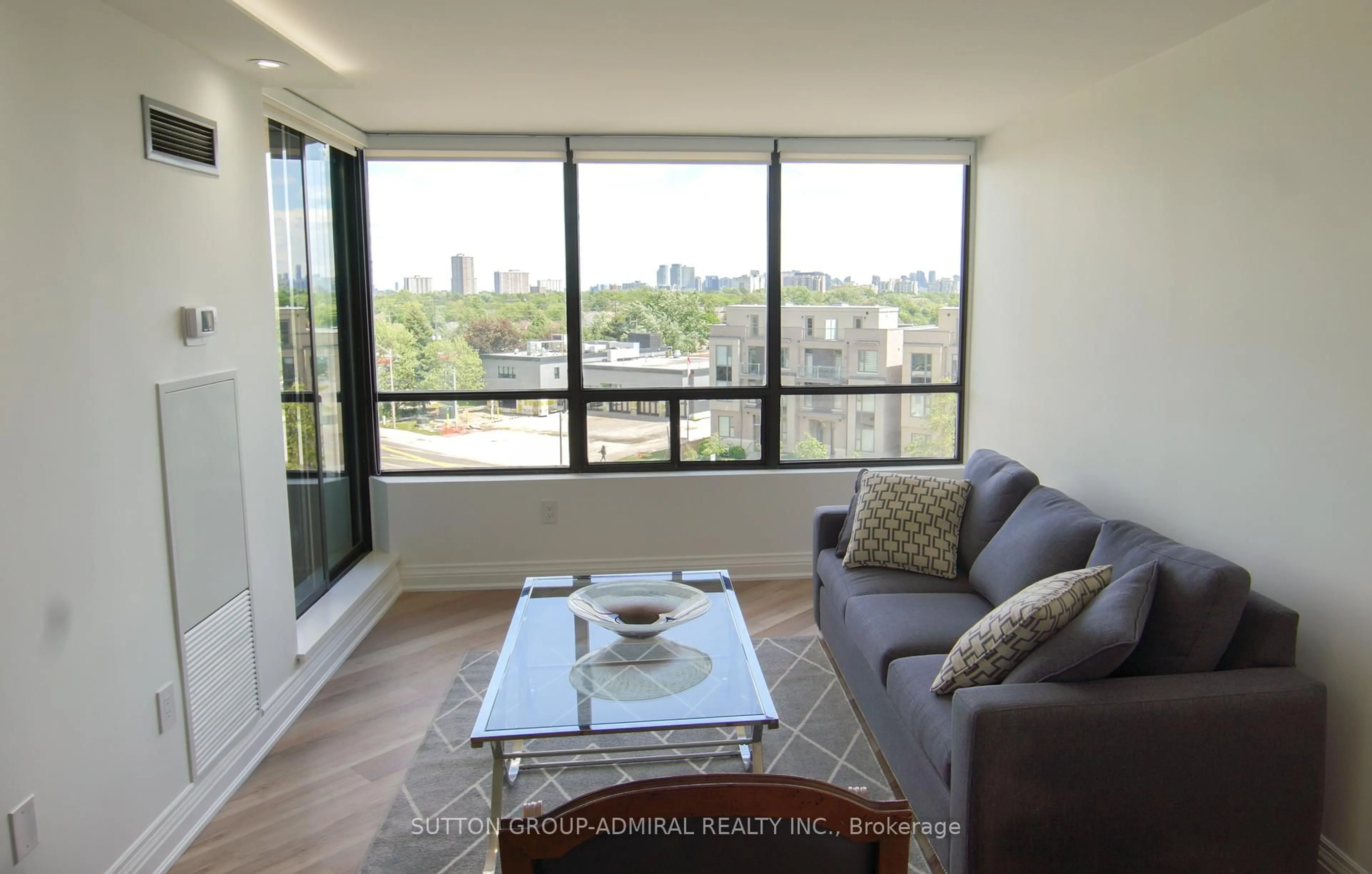 Living room with furniture, wood/laminate floor for 7420 Bathurst St ##606, Vaughan Ontario L4J 6X4
