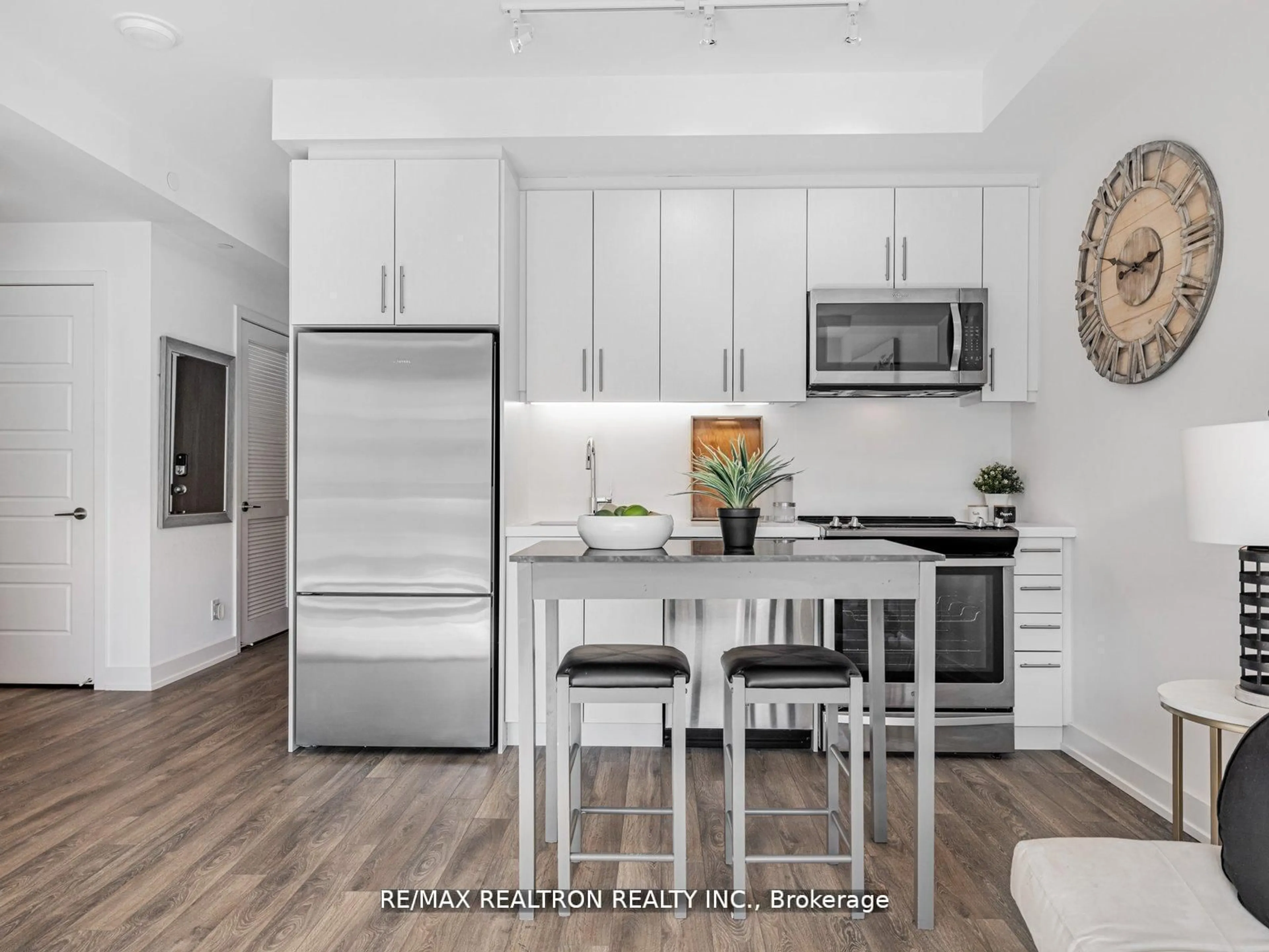Open concept kitchen, wood/laminate floor for 301 Sea Ray Ave #C312, Innisfil Ontario L9S 0L8