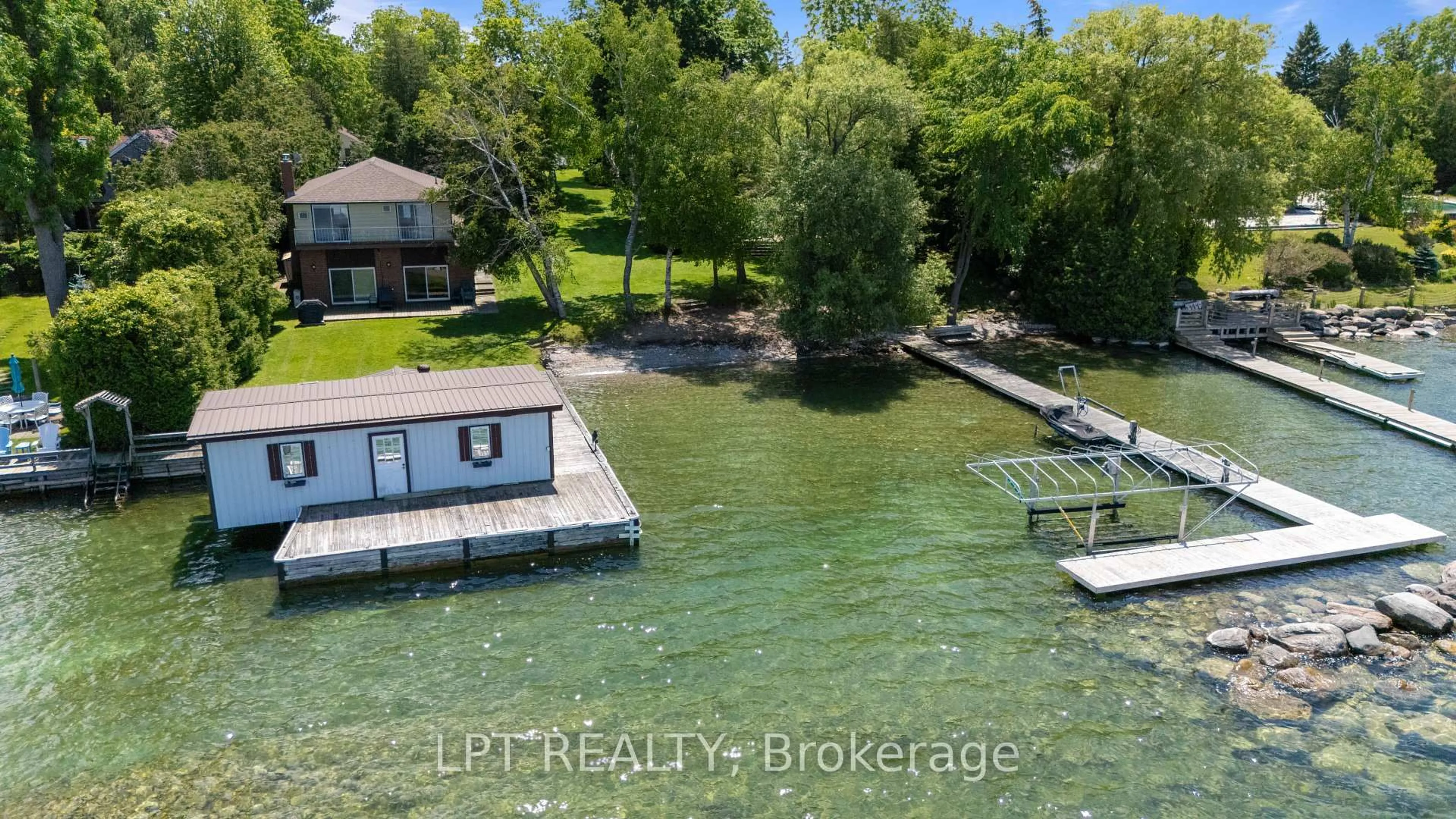 A pic from outside/outdoor area/front of a property/back of a property/a pic from drone, water/lake/river/ocean view for 678 Lake Dr, Georgina Ontario L0E 1S0