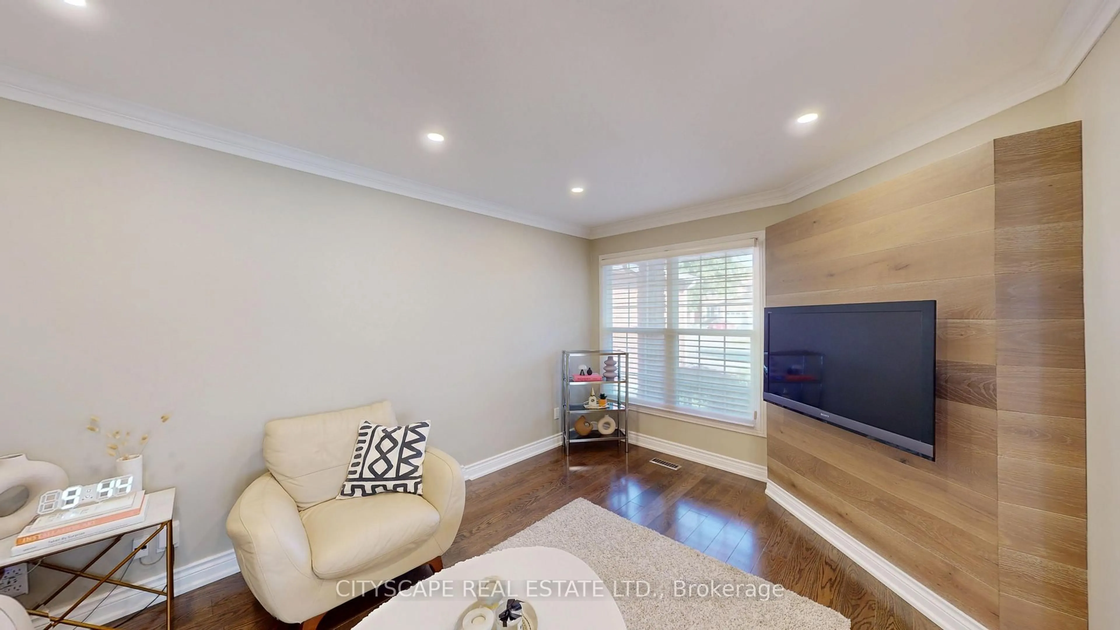 Living room with furniture, wood/laminate floor for 17 Badessa Circ, Vaughan Ontario L4J 6E7