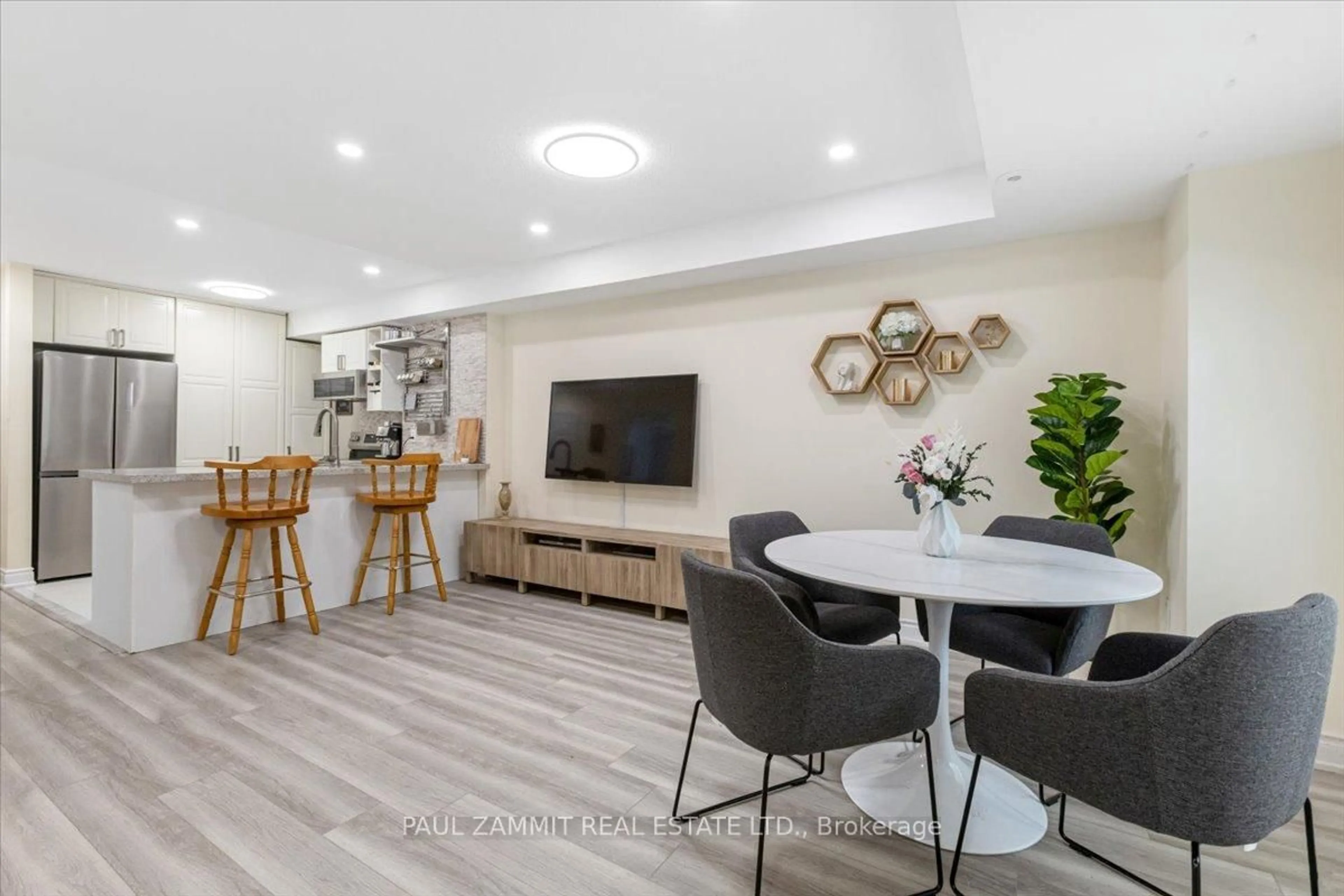Living room with furniture, wood/laminate floor for 310 John St #169, Markham Ontario L3T 0A7