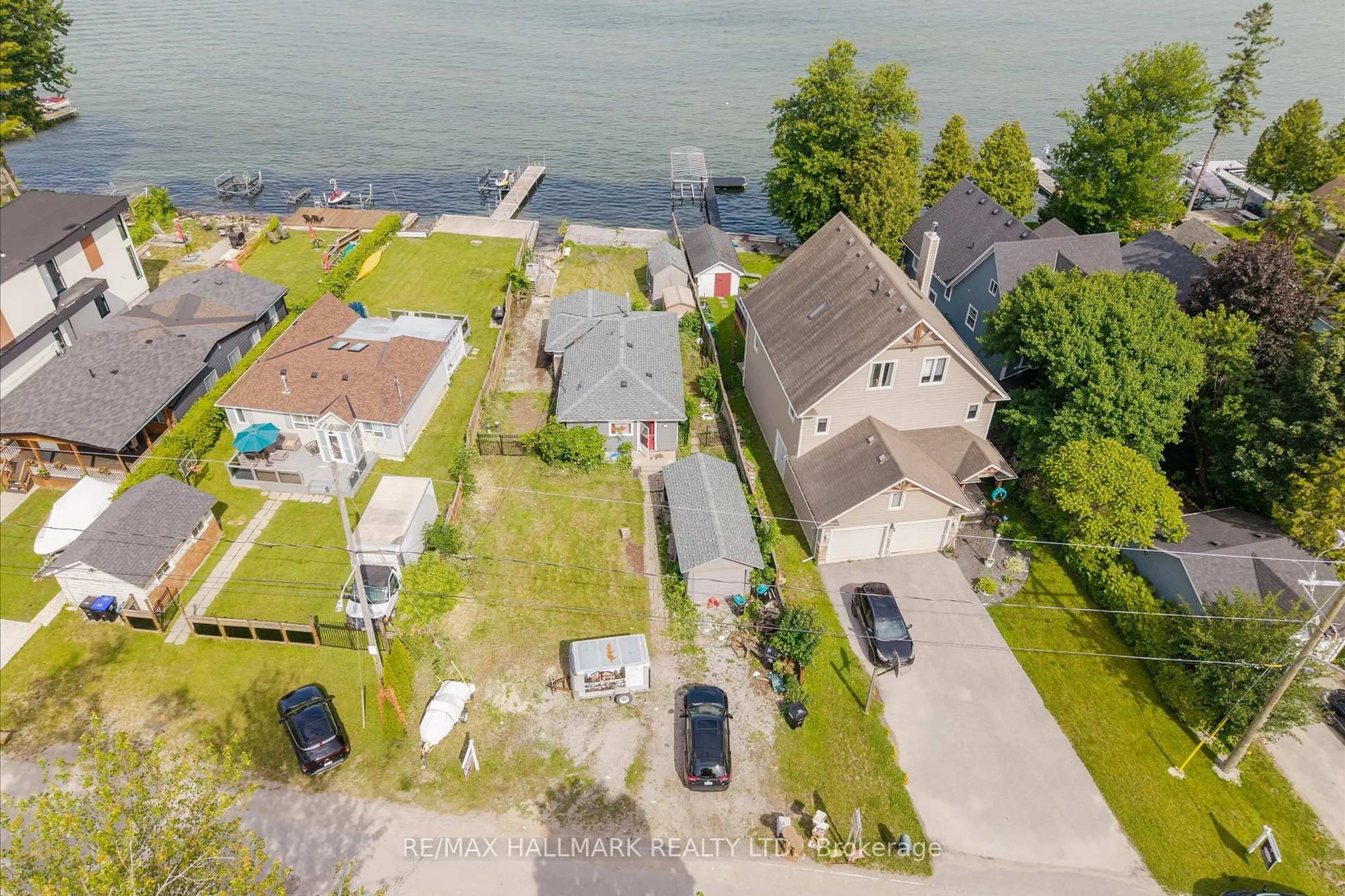 A pic from outside/outdoor area/front of a property/back of a property/a pic from drone, water/lake/river/ocean view for 2329 Crystal Beach Rd, Innisfil Ontario L9S 3W8