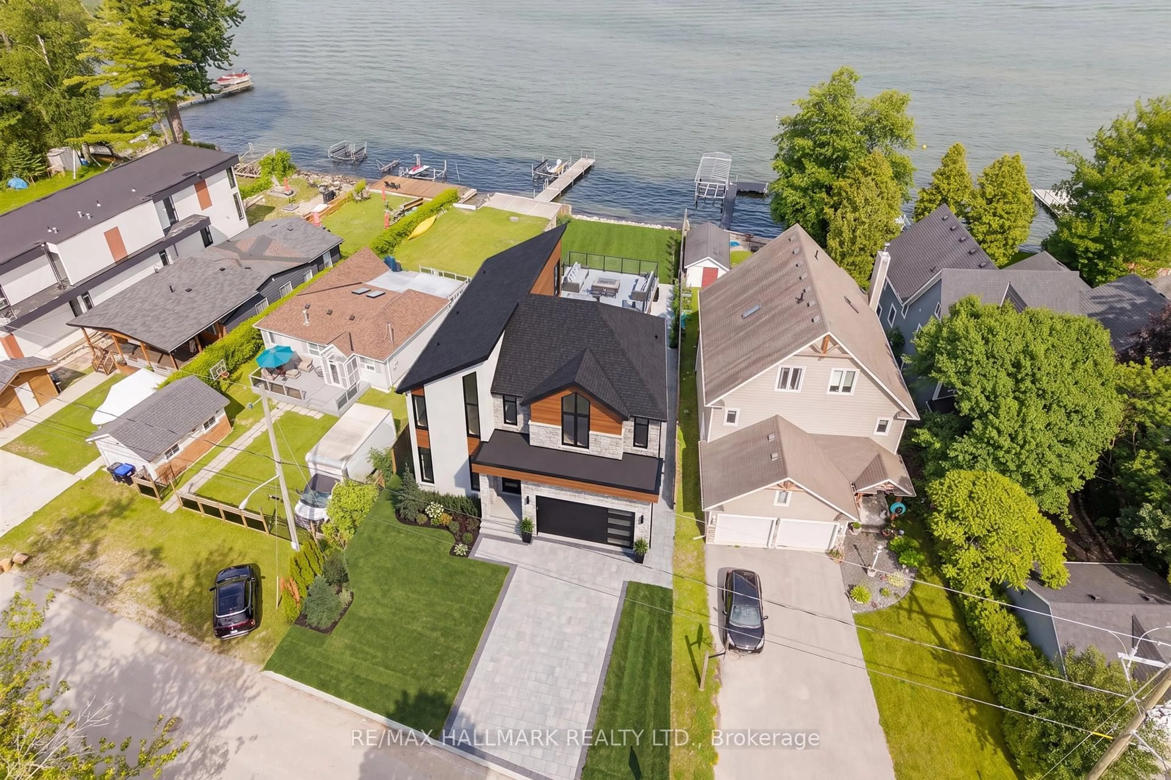A pic from outside/outdoor area/front of a property/back of a property/a pic from drone, water/lake/river/ocean view for 2329 Crystal Beach Rd, Innisfil Ontario L9S 3W8