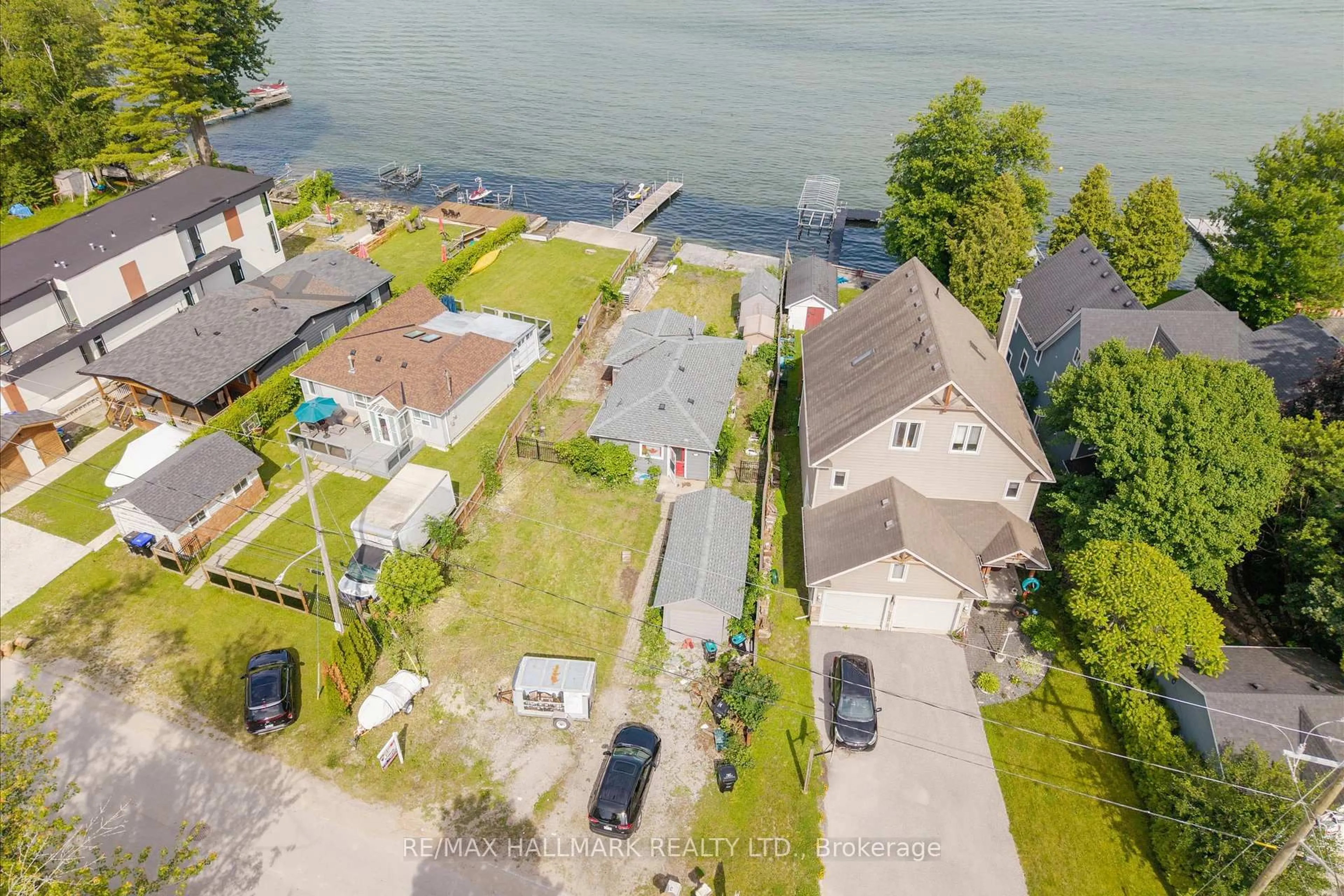 A pic from outside/outdoor area/front of a property/back of a property/a pic from drone, water/lake/river/ocean view for 2329 Crystal Beach Rd, Innisfil Ontario L9S 3W8