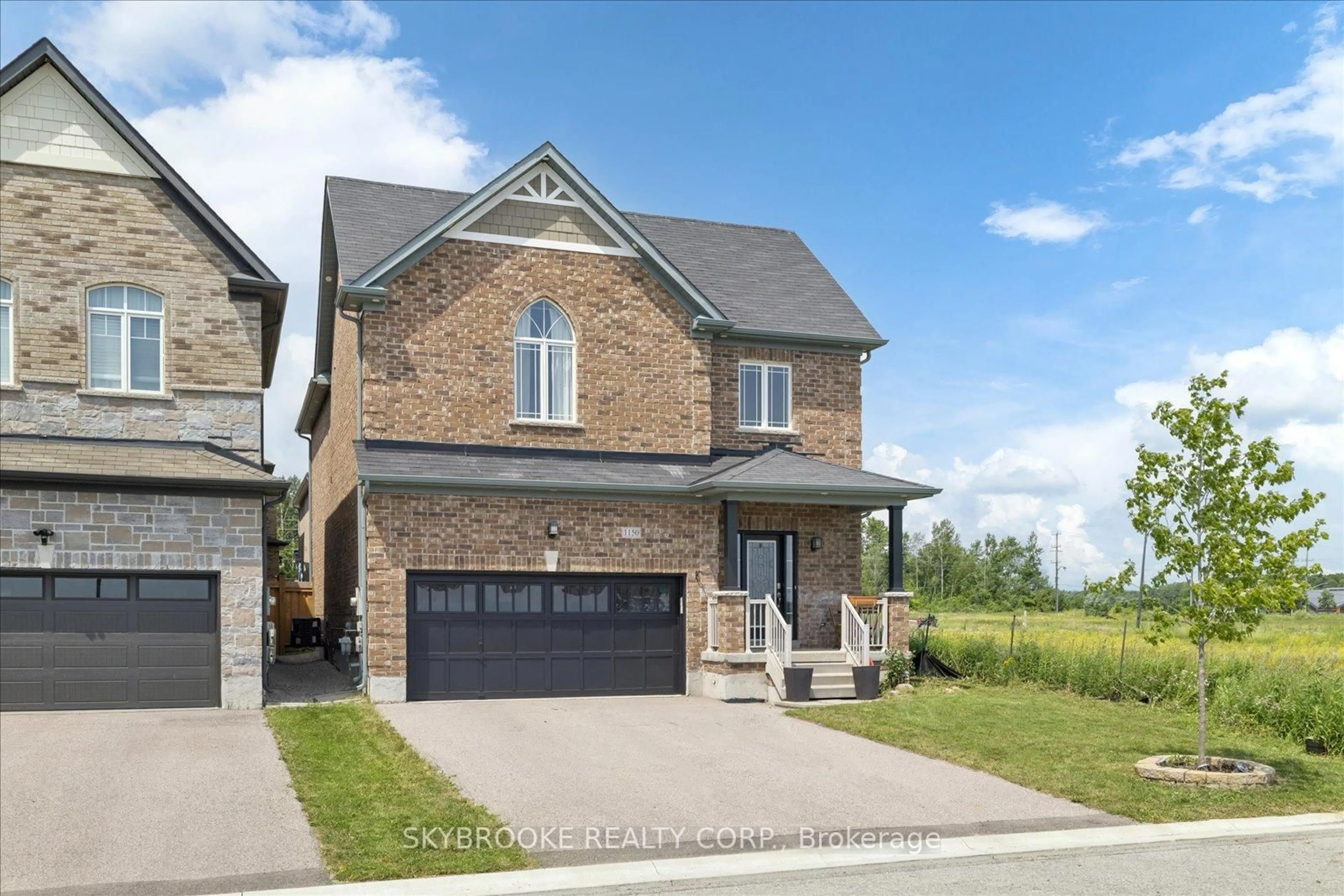 Home with brick exterior material, street for 1150 Wharram Way, Innisfil Ontario L0L 1W0