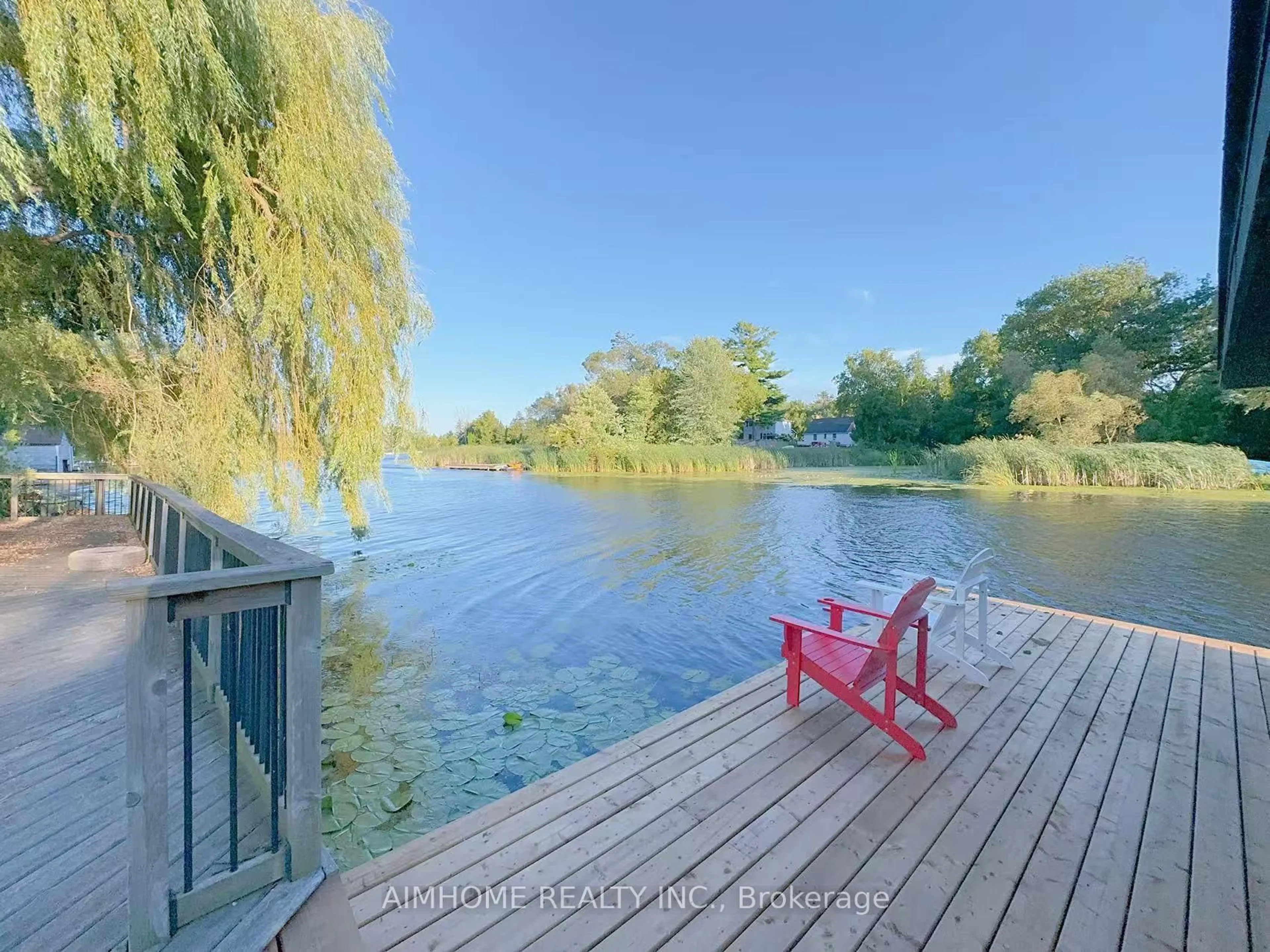 A pic from outside/outdoor area/front of a property/back of a property/a pic from drone, water/lake/river/ocean view for 151 Riveredge Dr, Georgina Ontario L4P 2P4