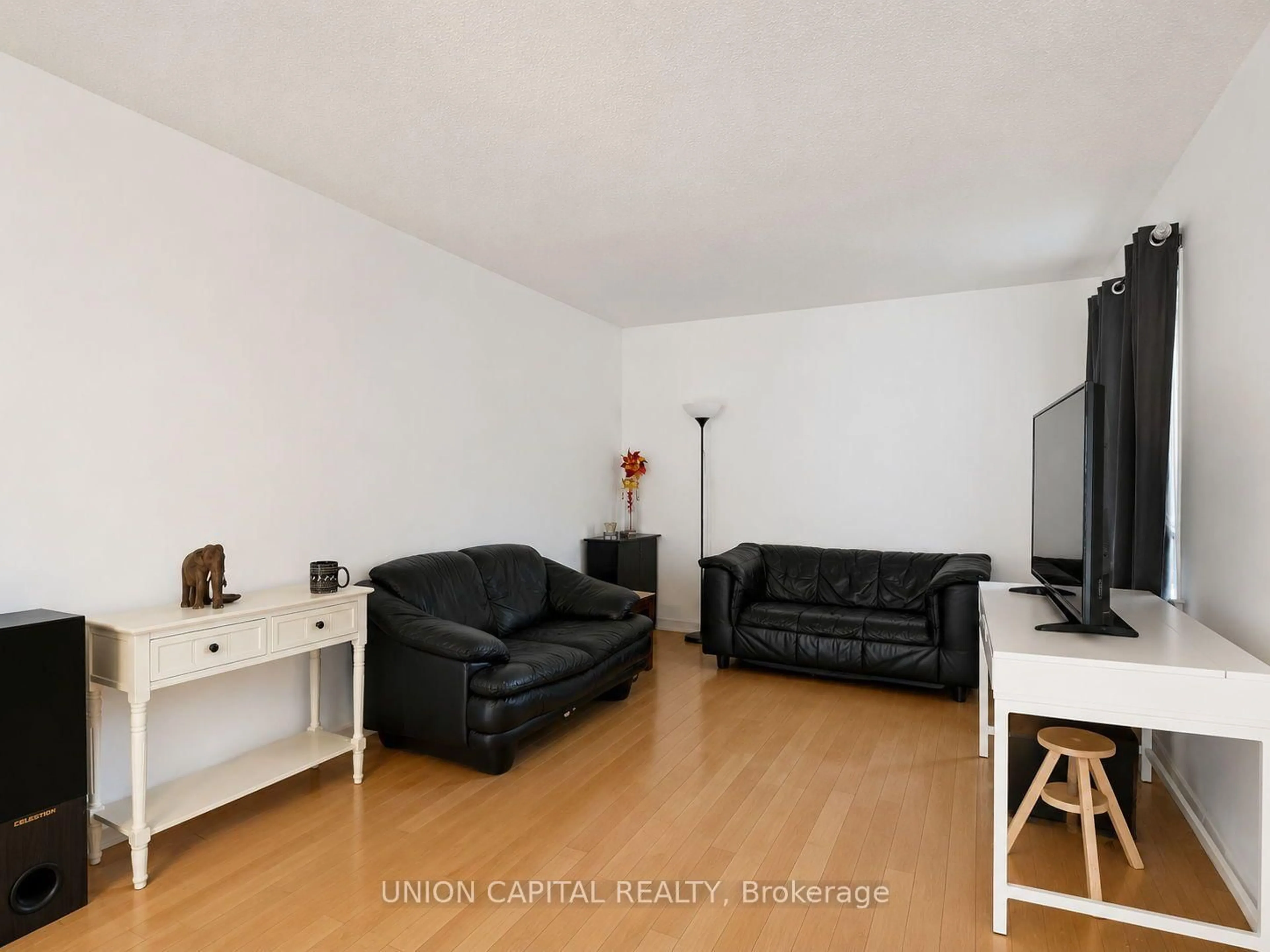 Living room with furniture, wood/laminate floor for 34 Timbers Circ, Markham Ontario L3S 1E4
