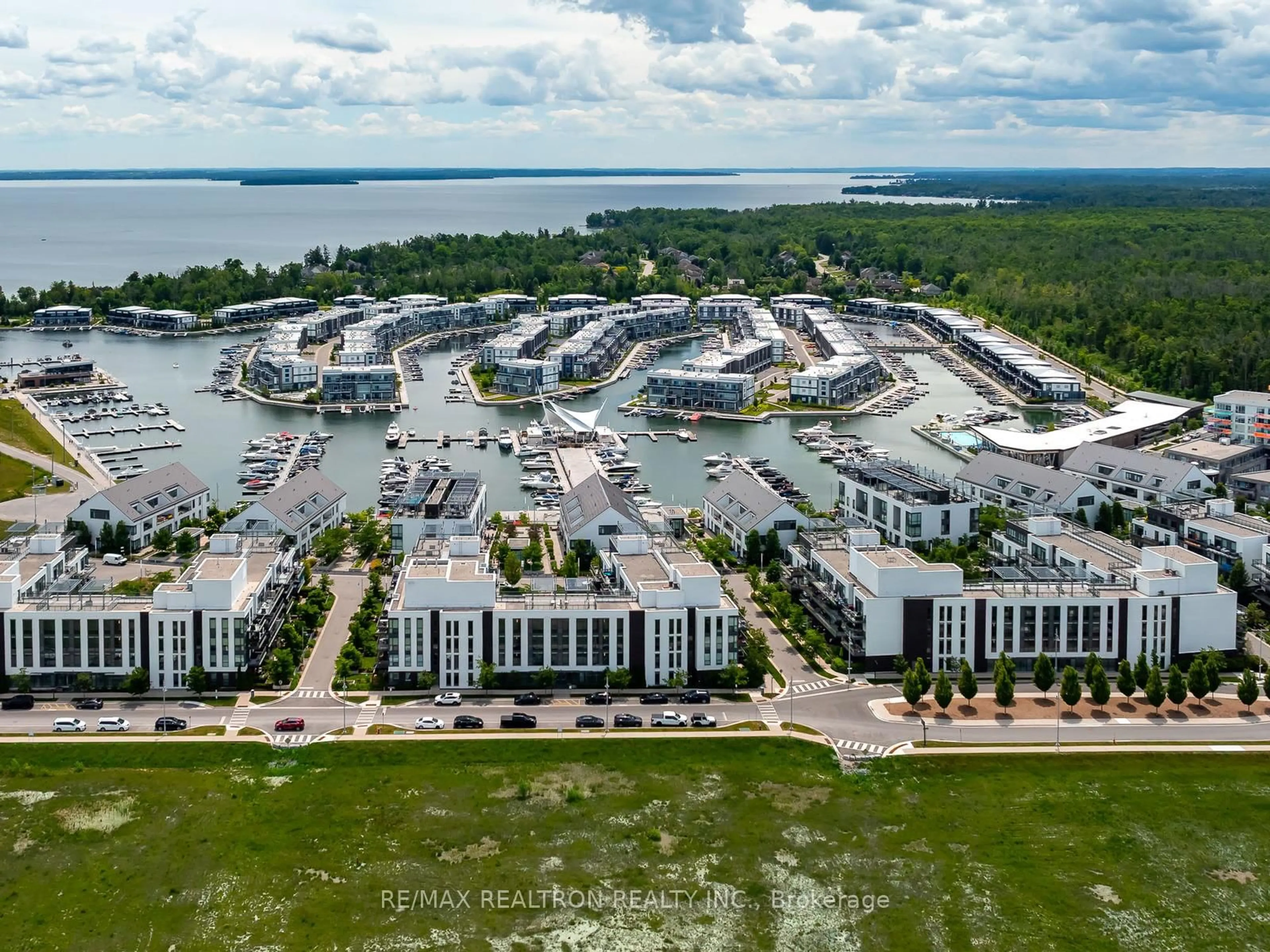 A pic from outside/outdoor area/front of a property/back of a property/a pic from drone, water/lake/river/ocean view for 271 Sea Ray Ave #B208, Innisfil Ontario L9S 0J4